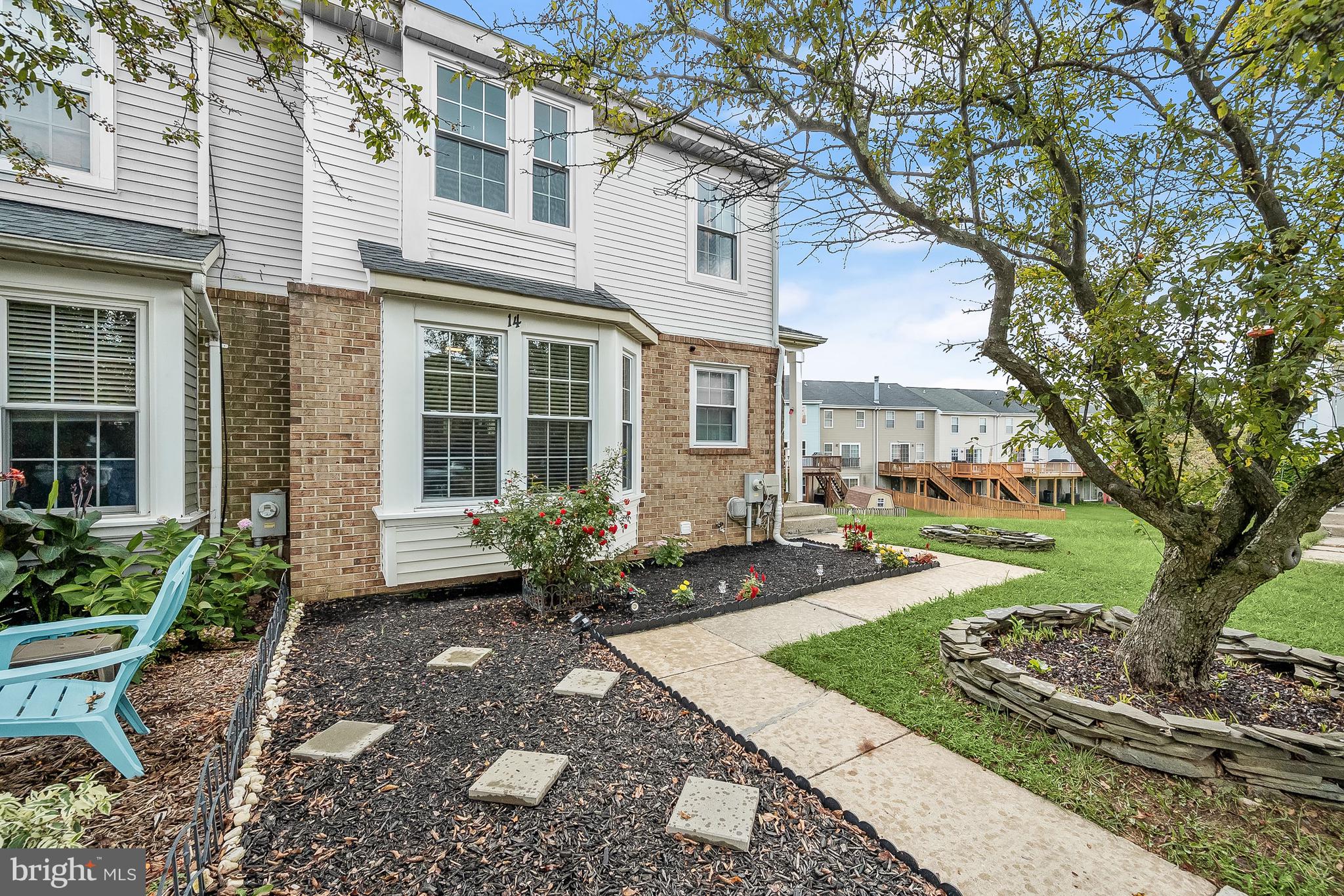 Welcome to this charming three bedroom end-unit townhome tucked away in the desirable Timbergrove neighborhood. Beautiful landscaping greets you as you arrive, and inside, gorgeous engineered hardwood floors and a neutral color theme welcome you. Prepare your favorite meals in the eat-in kitchen that boasts granite countertops, tile backsplash, center island, two pantries, breakfast nook, brand new electric range, and a pass through window to the rest of the main level. The open-concept living and dining rooms are spacious enough for any size gathering and feature a cozy wood-burning fireplace and sliding glass doors to the expansive freshly-painted deck with a privacy screen and solar lighting. Upstairs, the primary bedroom suite awaits with a vaulted ceiling and a private bathroom. Another two bedrooms and a second full bathroom complete the upper level. Downstairs, the fully-finished walkout basement features a large recreation room and a den that is ideal for a home office, playroom, or even a possible additional bedroom. With the lower level patio and the expansive wrap-around deck, there is plenty of space for spending time outside relaxing or entertaining. This fantastic corner lot is surrounded by open common areas, making it the perfect setting. Enjoy the community amenities including an outdoor pool and playgrounds. Endless recent upgrades including a new water line from the street (2023), upper level carpet (2022), clothes washer (2022), clothes dryer (2019), new roof (2018), attic insulation (2019), new windows and exterior doors (2019), sump pump and basement waterproofing (2019), water heater (2017), and the air ducts were cleaned last year.