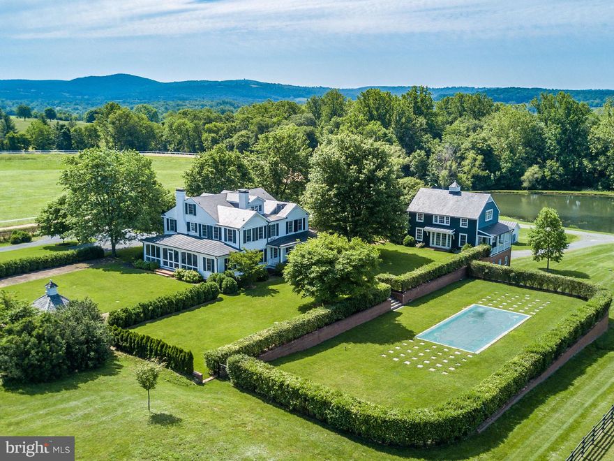 Hickory Tree Farm - 304 acres - renowned working equestrian property within a mile of the village of Middleburg.  Beautifully renovated home surrounded by exceptional facilities and all the necessary supporting outbuildings.  The compound includes the main house, stunning guest house with garage, 2 tenant houses, manager's house, apartment complex, pool, 5 barns totaling approximately 60 stalls, 3/4 mile all weather sand track, pond and extensive paddocks, fencing and sheds.  Property is served by four separate gated entrances with access from Burrland Lane and Zulla Road.  The highest knoll in the center of the farm offers panoramic views of Bull Run Mountains and the Blue Ridge Mountains offering an extraordinary building site if desired.  The lovely original home site still surrounded by towering trees, garden and stone walls.  The property is in conservation easement and may not be further divided.