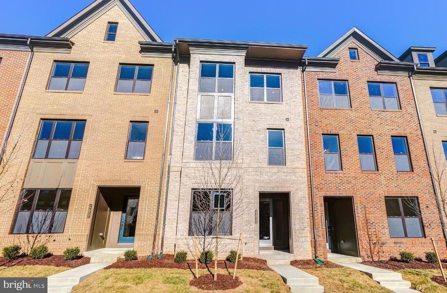 Large Luxury Smart Townhome With All Of The Latest Finishes And Gadgets- Enjoy living in this well appointed, less than 2 years old, 3+ bedroom Hudson model with all the right Designer options- including a LL den/guestroom. Enjoy the roof top loft and balcony, or the main floor covered porch and deck. Designer kitchen with quartz counters,  SS appliances and large island. The master bedroom will please you with a large lux bath and huge closet.  2 car garage with electric car charger port. Amazing community amenities and Top Loudoun Co. Schools. Includes your FIOS Internet + HD TV + Phone in $150  HOA Fee. Walk to Brambleton Town Center and enjoy shopping, entertainment, dining and the Regal Imax Theater.  Walking distance to the amazing One Life Fitness.