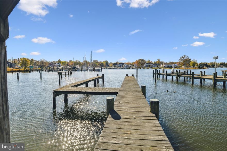 This is a waterfront retreat, complete with stunning water views and your own private pier with deep water access. This mid-century modern, one-level Rancher features an open floor plan, offering the flexibility to design spaces that suit your style and vision.  
The light-filled Sun Room provides the perfect spot for relaxing or entertaining, while the spacious Game Room, complete with a custom built-in bar, offers endless possibilities for recreation, hobbies, or additional hang-out space.  
A detached 2-car garage with extra storage space adds practicality and convenience, with plenty of room for your equipment, tools, and watercraft.  
This property is a rare opportunity to create your dream waterfront home while enjoying the versatility and charm of this unique property.