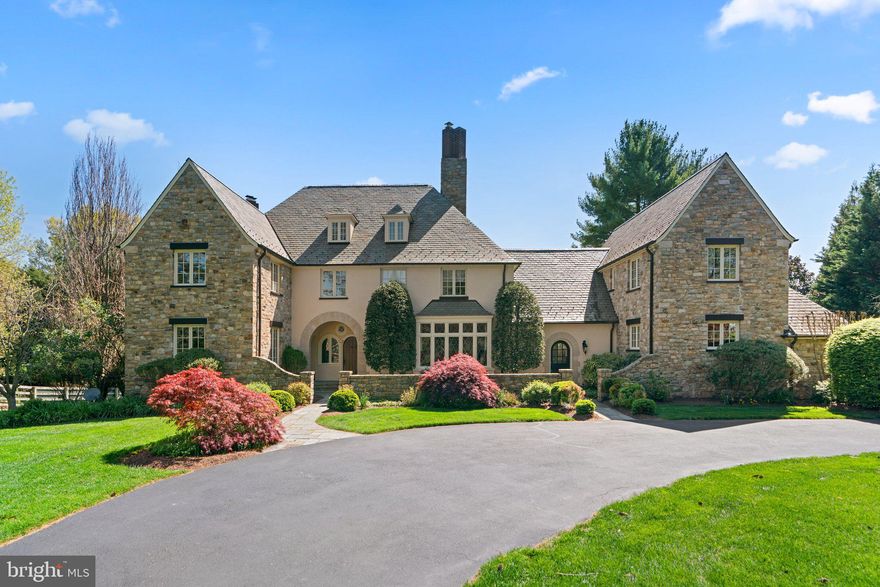 Nestled within the prestigious Highgate neighborhood, this captivating English Country estate sits on a meticulously maintained 2-acre lot, offering breathtaking panoramic views of rolling hills, a tranquil private pond, and the surrounding natural landscape. Crafted by the esteemed Brendan O’Neil, this remarkable home emanates character and charm, showcasing bespoke millwork, intricate moldings, and refined cherry and herringbone flooring throughout.
 
Upon entry into the inviting two-story foyer with decorative leaded glass windows and custom milled archways, discover a state-of-the-art kitchen seamlessly integrated with the adjacent family room, featuring a striking stone fireplace. The sun-drenched morning room beckons with its serene vistas, while a butler's pantry connects to the formal dining room, ideal for hosting gatherings. Completing the main level is a private home office with cherry-paneled walls, a formal living room, and a convenient mud/pet-room with front and rear entrances.
 
Ascending upstairs reveals the luxurious owner's suite boasting ample closet space, a dressing room, and a spa-inspired bathroom for indulgent relaxation. Additionally, a separate guest suite with its own entrance and multiple bedrooms with ensuite bathrooms ensure comfort and privacy for both residents and guests.
 
The lower level presents an entertainer's paradise, comprising a cozy media room, a well-appointed kitchenette/bar, an exercise room, a game room, a versatile guest room/den, and a rejuvenating steam shower in the full bathroom. An artist's studio and a walk-out to the expansive outdoors provide an idyllic space for creativity and leisure.
 
This meticulously designed estate epitomizes sophisticated country living, seamlessly blending luxury, comfort, and the splendor of nature.