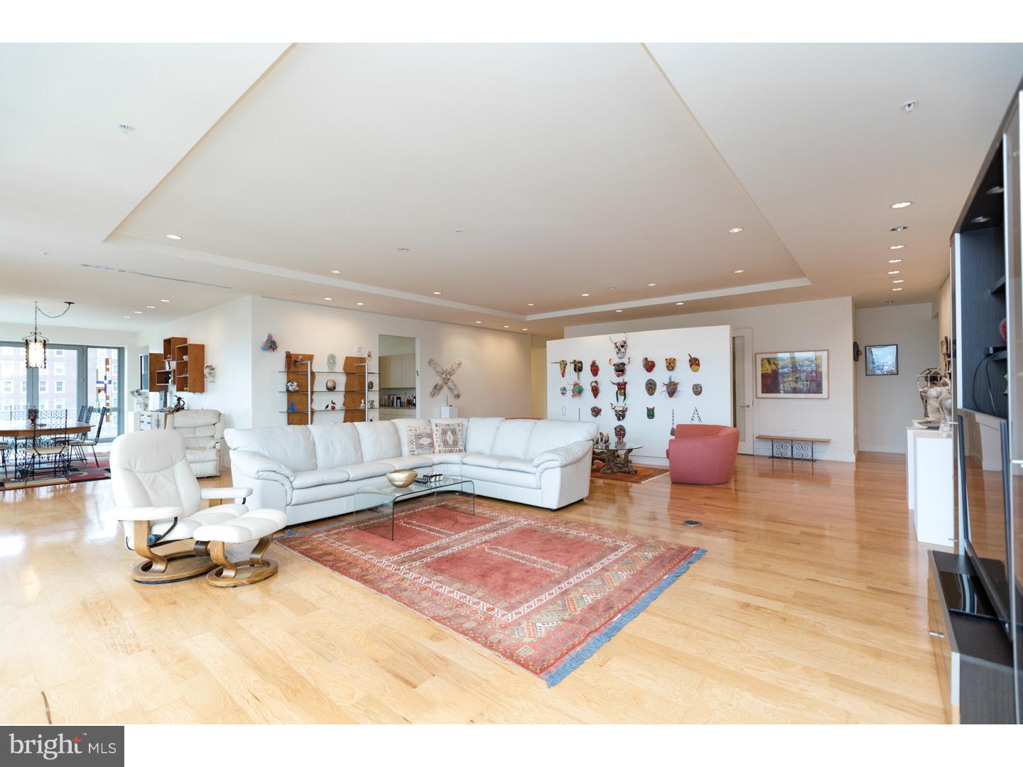 Rarely available entire floor showplace at the highly coveted 1706 Rittenhouse, only one-half block from Rittenhouse Square. This 3 bedroom plus den, 2.5 bathroom showcases 360-degree city views from walls of windows in all rooms. Enter the condominium directly off the secure elevator into a private vestibule. A set of French doors opens into a sun-soaked living room offering several gallery walls, space for multiple seating areas, a Juliet balcony and see-forever views to the south. Open to the living room is a formal dining room providing access to a 16' balcony. There is a chef's kitchen boasting a large breakfast nook, incredible cabinet and counter space, large breakfast bar, tile floor, granite countertops and commercial grade appliances including a Wolf range, wall oven and microwave and Sub-Zero refrigerator/freezer. The other side of the residence features a luxurious corner master bedroom suite with custom built wall and walk-in closets and a bathroom appointed in marble with a double vanity, private commode, soaking tub and seamless glass enclosed walk-in shower. One guest bedroom enjoys sunrise city views to the east and skyline views to the north with easy access to a full hall bathroom. The other guest bedroom was most recently used as an art studio and can easily be converted into a bedroom suite with the addition of a bathroom. There is recessed lighting throughout and there are hardwood floors in the foyer, living room and dining room and carpet in the bedrooms and den. Additional home highlights include a den/office, powder room, laundry room with utility sink and side-by-side washer and dryer, and a utility room with access to the service elevator. One parking space in the building's garage and one storage space are included. Residents enjoy amenities that are second to none, including a 24-hour doorman, automated parking garage, heated indoor pool, state-of-the-art fitness center, chauffeur driven 700-Series BMW and landscaped garden with Koi pond. Rittenhouse Square is ranked the 6th best neighborhood in North America by Places Rated Almanac. There are 175 restaurants and 199 retailers within a three block radius. 1706 is within close walking distance to the Market Street office corridor, The Avenue of the Arts and University City. 30th Street Station and Philadelphia International Airport are only minutes away.