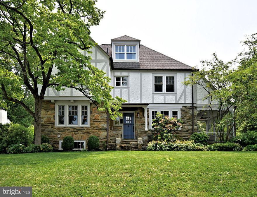 🏡 19 Croton Rd, Wayne, PA 19087
A Rare Jewel in Deepdale—Where Timeless Tudor Charm Meets Modern Luxury
Welcome to your forever home—an exquisitely restored 1925 Tudor nestled in the coveted Deepdale neighborhood, where old-world charm and refined modern living coexist in perfect harmony. Offered for the first time since its stunning 2023 renovation, this residence is more than a home—it's a handcrafted masterpiece.
A winding path of stone slabs leads you through lush greenery, perennial gardens, and fresh mulch beds—beautifully lit by low-profile landscape lighting. Shade trees frame your arrival, while a bold blue front door set in a rustic stone façade welcomes you with undeniable warmth and character. The home’s classic exterior—irregular stone masonry with soft gray Tudor boards—exudes historic elegance.
Step inside and immediately feel the difference. Solid white oak floors stretch across a radiant-heated open layout, radiating comfort and craftsmanship. Every element has been masterfully designed by Rockwell Custom Homes and Z Domus Design—from artisanal millwork and custom cabinetry to Calacatta Bluette marble countertops with white Zellige backsplash and Sub-Zero & Wolf appliances. This is where luxury lives.
Host elegant soirées on the private bluestone patio or unwind at the wet bar—complete with a hand-hammered nickel sink—curated for the discerning entertainer. Need a spot to keep mornings running smoothly? The custom mudroom, just off the entry, features built-in children’s lockers to keep backpacks and coats in check, bringing daily calm and order.
In the formal living and dining rooms, deep-set windows evoke classic Tudor charm. The living room showcases a fully restored stone wood-burning fireplace, while the dining room boasts a refined built-in lighted buffet—both enhanced by tasteful recessed lighting. Through the original French doors, discover a screened-in stone porch—a dreamy setting for Sunday tea, surrounded by the scent of blooming lavender.
Upstairs, your luxurious primary suite waits. French doors open to a private balcony bathed in morning light. The en suite bath exudes elegance with marble finishes and dual California Closets that blend beauty with function.
Three additional spacious bedrooms share a wide, light-filled hallway and an elegant full bath with ceramic and micro-tile finishes. A second-floor laundry adds convenience with style—making chores feel like a treat.
The surprises continue.
A third-floor retreat awaits—perfect for guests—complete with a private full bath that exudes spa-like elegance. It features a white wood vanity topped with marble, Moroccan floor tile, accented by a glass-enclosed walk-in shower with a stunning emerald green tile, and a beautifully restored original grey and white clawfoot tub; all with matching chrome fixtures. 
A finished lower level adds even more versatility, offering space for a home gym, media room, or play area—tailored to fit your lifestyle, plus an abundance of storage w/Bilco Door exit.
The fully updated two-car garage is EV-ready—proof this home is as forward-thinking as it is timeless.
You're minutes from downtown Wayne’s boutiques and bistros, SEPTA’s Strafford Station, and proudly located in the award-winning Tredyffrin/Easttown School District.
This isn’t just a move. It’s your upgrade. ✨ Welcome to Deepdale. Welcome home.