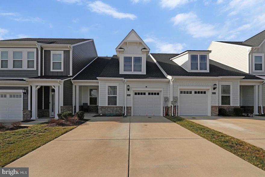 This nearly new home offers a single-floor layout which ensures maximum comfort and convenience.   A beautiful  open-plan layout  connects a multi-functional Kitchen, a lovely Dining Room, and a welcoming Great Room with sliding-glass doors. A bright luxurious owner’s suite boasts a spa-inspired bathroom and a spacious walk-in closet. A secondary bedroom off the foyer provides a secluded retreat for family members or overnight guests.

Parklands Villas Community, an active adult community for individuals aged 55 and older. It offers Homeowners  an onsite community center, a swimming pool, an exercise room, walking trails, and an event room  is available  for reservations. The Parklands are conveniently located near great shops, restaurants, parks, and golf courses, making it ideal for outdoor activities. Additionally, the Capital Beltway offers easy access to Washington, D.C.

One of the significant advantages of purchasing this home is that a portion of the Fair Share Excise Tax
and a portion of the Front Foot Fee have already been paid. This means homeowners can enjoy a substantial savings.

**additional parking and an open access area are located across the street. 
HOA documents are available to share.

**Front foot fee and Fair Share Excise Tax have been paid for several years.