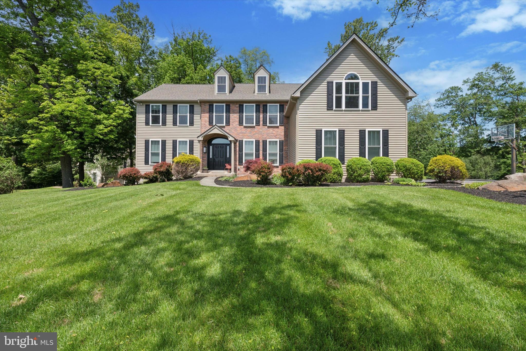 Welcome to 915 Kenmara Drive, a beautifully renovated Colonial residence nestled in the highly sought-after Kenmara community of West Chester, Pennsylvania. This elegant home offers over 5,100 square feet of upgraded living space on a meticulously landscaped large back yard opening up to a "Wyeth like” view of a picturesque farmette. Originally built in 1999, the interior was completely renovated in 2018 including kitchen, primary bath, hardwood flooring throughout, stairs, rails, fixtures appliances and more. In 2020, a new HVAC system was installed to ensure efficient climate control, and in 2025, the entire exterior received a stunning transformation, including new windows that enhance both aesthetics and energy efficiency.
As you enter through the grand two-story foyer, you are welcomed by an open, light-filled interior that flows seamlessly throughout the main level. The formal living and dining rooms showcase classic crown molding and gleaming hardwood floors, while the spacious family room centers around a cozy wood-burning fireplace, creating an inviting gathering space. The gourmet kitchen, thoughtfully updated during the renovation, boasts white cabinetry, a center island, a built-in hutch, and a five-burner stainless gas stove with a convection oven. Adjacent to the kitchen is a generous breakfast area, a mudroom, and a walk-in pantry, offering convenience and ample storage.
A private office on the main level provides a quiet retreat with views of the serene backyard, perfect for work or study. Upstairs, the primary suite features a vaulted sitting area, two large walk-in closets, and a spa-like en-suite newly renovated bathroom with dual vanities, a soaking tub, and a separate shower with seamless glass. Three additional bedrooms share a well-appointed hall bath, all with generous closets and abundant natural light.
Step outside to enjoy the professionally landscaped backyard, complete with a spacious deck—ideal for entertaining, outdoor dining, or relaxing in a peaceful setting. Additional amenities include a three-car garage, a main-level laundry room, and a full finished basement with a bedroom and bathroom for guests.
Located in East Bradford Township, this home offers a tranquil suburban lifestyle just minutes from downtown West Chester, local parks, top-rated schools, and major commuter routes.
915 Kenmara Drive represents a rare opportunity to own a meticulously upgraded home in one of Chester County’s most desirable neighborhoods.
