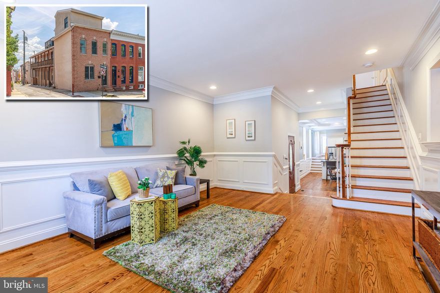 STYLISH AND SPACIOUS END OF GROUP BUTCHERS HILL ROWHOME WITH 4 FINISHED LEVELS & OFF STREET PARKING! Inviting living room w/ wainscoting, crown molding, and exposed brick, separate dining area, gourmet Chef's kitchen w/ ss appliances and granite counters, main level half bath and laundry area, upper levels with 3 bedrooms and 2 full baths including a Master bedroom w/ a walk-in closet with built-ins, a bonus room in the basement that is perfect for a home office along with plenty of storage space, large rear deck off of the 2nd level which leads to the unique wraparound balcony, a rooftop deck with incredible views, and coveted off street parking!  All this and it is conveniently located 1 block from Patterson Park and close to Johns Hopkins and Harbor East!