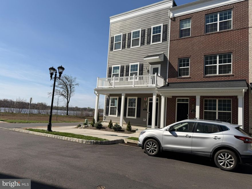 Stunning  townhome along the Delaware River offering breathtaking water views, exceptional natural light, and a charming front courtyard setting. Built in 2022, this modern four-level home delivers the perfect blend of style, functionality, and location—just minutes to the train station, I-95, the New Jersey border, and a short drive to Parx Casino.

This spacious 3-bedroom, 3 full and 1 half-bath residence features a thoughtfully designed layout ideal for both everyday living and entertaining. The entry level includes a versatile flex space and access to a rear-entry one-car garage, providing convenient off-street parking.

Investor Friendly. Tenant-occupied through June 30th. Buyer has the option to assume the current lease and receive rental income, or schedule settlement after June 30th for owner occupancy.

The main living level showcases a bright open-concept design with a beautifully appointed kitchen featuring stainless steel appliances, granite countertops, and ample cabinetry. The adjoining dining and living areas flow seamlessly to a private rear deck with serene Delaware River views—perfect for indoor-outdoor living.

Upper levels offer well-proportioned bedrooms and flexible living space to suit a variety of needs. The top floor stands out with a bonus area, full bath, and access to a spectacular rooftop deck with panoramic 360-degree river views—an ideal setting for relaxing or entertaining.

A rare opportunity to own a riverfront home with premium views, modern features, and unbeatable convenience.
