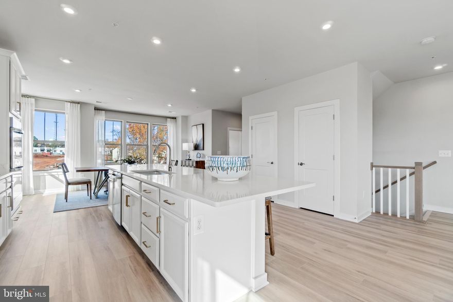 Brand new Stanley Martin townhome-style condo! Indulge in unrivaled comfort and relaxation at the Julianne townhome-style condo - featuring a stunning design, three spacious bedrooms, a garage, and a covered balcony. The open main level layout is ideal for hosting dinner parties or large gatherings, while the covered balcony offers the perfect place for refreshing coffee mornings or fun game nights with friends.

Retreat to your personal sanctuary upstairs in the lavish primary suite - the ultimate setting to unwind after a busy day. Discover the pinnacle of modern amenities and impeccable design at the Julianne. Rest assured, this is the home you have been seeking to complement your refined lifestyle.

Design options selected for this home include Barnett Duraform Painted Linen Kitchen Cabinets, Frost White Quartz Countertops, Kohler Finishes, GE Appliances, Chesapeake Newport LVP, and more.

The photos shown are from a similar home. Contact the Neighborhood Sales Manager or stop by our offsite sales office at Liberty Park located at 2337 Liberty Loop, Herndon, VA 20171.