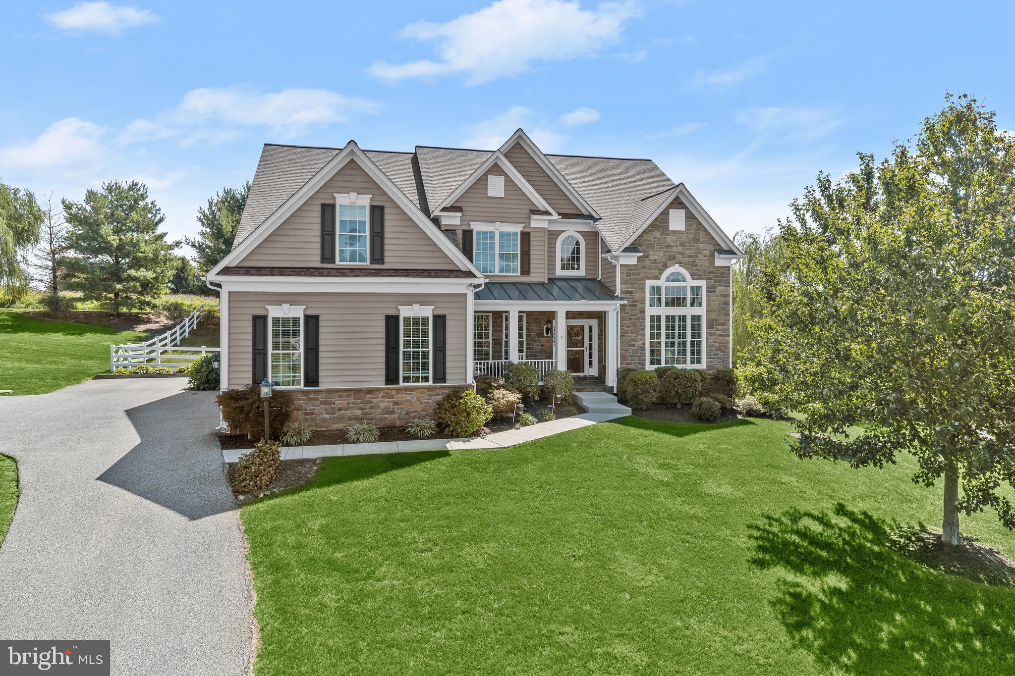 Stunning colonial settled on an acre of pristine landscaping provides an ideal blend of craftsman and traditional styles. Arrive through the front door or the three-car garage and experience an open-concept floor plan that allows for entertaining family and friends with ease. A formal dining and living room on either side of the two-story grand foyer is highlighted by a palladian and picture window, a vaulted ceiling, a chair railing, double crown molding, and gorgeous hardwood floors that continue throughout. Let the gourmet kitchen inspire delectable delights boasting a center island with a breakfast bar, a planning station, 42” classic trim soft close cabinetry with pull-out drawers, stainless steel appliances, a geometric decorative backsplash, and granite counters. The breakfast area guides you into the four seasons sunroom that allows for an abundance of light to cascade in and provides access to the rear spacious patio ideal for spending time with loved ones. Enjoy cool evenings curled up for movie night in the sprawling family room featuring a gas-burning fireplace, plush carpet, and custom blinds. A bedroom suite and a laundry room complete the main level. Through french doors, arrive into the impressive primary bedroom suite offering a tray ceiling, three closets, one being a walk-in closet, and an ensuite with a double vanity, a soaking tub, and a glass door ceramic tile walk-in shower. Three additional bedrooms and two hall baths complete the upper-level sleeping quarters. The fully finished lower level allows for a plethora of possibilities with the second gas-burning fireplace, built-in bookcases, a full bath, a fitness room, or a possible bedroom or office. Updates: 2023-New Range Hood, Backsplash, 2022-Kohler 20KW Generator, 2021-Maintenance Free Fence Back Yard, 2020-50 Year Architectural Shingle Roof Replaced, 2020-Two Navien Tankless Hot Water Heaters Installed.