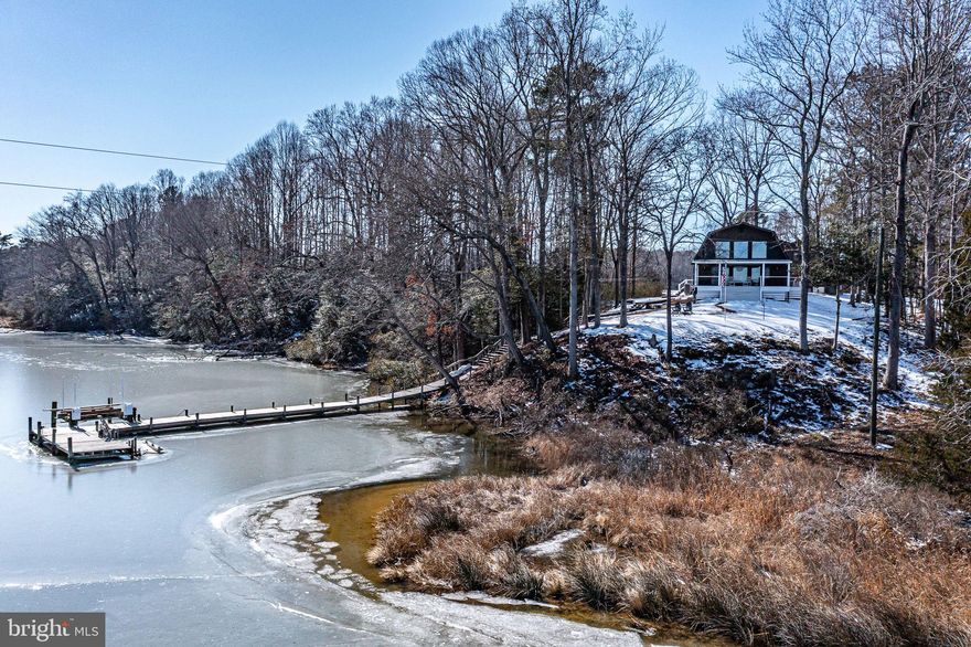 Privacy, wide views, and an open, Barn style home await you at 640 Meshachs Lane!  This .93AC property offers sweeping views out over the Great Wicomico River from your deck, with water access from a dock featuring a 12,000 lB lift, MLW 3-4’, and a kayak platform. Inside, the views continue from a spacious combined dining/great room with 2-story windows.  The updated kitchen with quartz countertops is a gem with recent SS appliances: refrigerator, microwave, dishwasher, and induction range. The main floor bath has also been recently remodeled; just steps from the main floor bedroom and convenient to the side entrance. The washer/dryer are conveniently located on this floor as well. Upstairs, a landing provides views out the upper windows; two more roomy bedrooms; and a hall bath complete the perfect coastal living picture!  Life gets more enjoyable by knowing all the major items have lots of life left in them – roof, heat pump, encapsulated crawl, exterior paint and stain, dock, and generator are all 5 years young or less.  Top it all off with a detached garage with finished upper bonus room, a separate 12x24’ shed plus a paved driveway.  Come for a visit and take it all in!