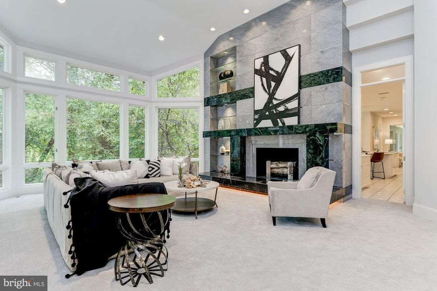 MOTIVATED SELLER for this "Home for All Seasons"!! Located in the heart of Potomac at the end of a quiet cul-de-sac on 2.41 acres, there is nearly 13,000 Sq.Ft. of finished space on three levels. Designed by Michael Ochsman, this modern masterpiece features a transitional floor plan with generous rooms, high ceilings, and loads of windows. The incredible Foyer welcomes you with its 15'+ ceiling and gleaming marble floors. The soaring ceiling continues from the Foyer into the Living Room where the floor-to-ceiling marble fireplace with raised hearth and built-ins complement the wall of windows that overlooks Falls Road Golf Course. A highlight of the first floor is a 49' indoor heated pool enclosed in a separate 62' X 27' structure adjacent to the informal Family Room and Kitchen. The Primary Bedroom Suite is on the Main Level and features multiple built-ins, 2 over-sized organized walk-in closets, and an En-Suite Bath.  There is plenty of space on the Upper Level with a Lounge surrounded by 5 Bedrooms, each with En-Suite Baths. The Walkout Lower Level provides opportunities for a variety of uses and includes an Exercise Room, a Recreation Room, a Powder Room, 2 Bedrooms, 2 Full Baths, and a Dark Room. Surrounded by lush mature landscaping, there is a Gazebo, multiple Patios, a Circular Driveway, and a 4-Car Side Entry Garage with large Courtyard. Ideally located close to Potomac Village, access to I-270 and I-495, Virginia, and downtown DC are in close proximity. Area residents can take advantage of the nationally rated Montgomery County School system as well as the area's three major airports.