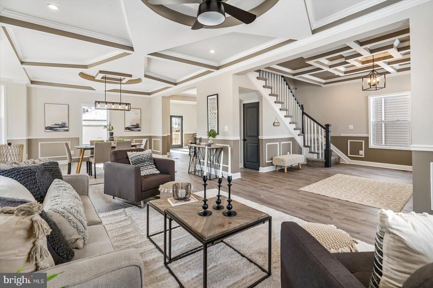 Welcome to this beautifully top to bottom renovated large porch front house with stylish finishes located in a well established neighborhood of Forest Park. 6 spacious bedrooms & 4 full & 1 half bathrooms including a huge primary en-suite that has a luxury spa like bathroom w/ soaking tub & separate shower, double Vanity & a large walk in closet. A bright OPEN floor plan with modern amenities. New designer kitchen w/ gorgeous granite countertops/ 42" tall soft close cabinetry/ Subway herringbone pattern backsplash / Island/ Stainless steel appliances & a range hood. Main level has 9 Ft. high ceilings & custom designed coffered ceilings, crown moldings, chair rails in living, dining & foyer. New flooring throughout the house including luxury vinyl plank flooring throughout the main & lower levels. New architectural roof, gutters & SIDING on the house. New drywall throughout the house. New deck, porch, windows, & doors. New Dual-zoned HVAC, TANKLESS HWH, plumbing, gas, & 2 sump pumps. New bathrooms with custom tile work & so much more. Electric 100% fully rewired throughout the house. Recessed LED lights. Finished basement has waterproof flooring & featuring a bedroom w/ a full bathroom. HUGE fenced backyard great for entertaining & summer BBQ's. No detail has been overlooked. Tons of natural light in this beautiful luxury house. Close to Lake Ashburton, Golf course, shopping mall, Baltimore Zoo, Downtown, SSA, parks and major highways including I-83 /695. A detached 2 car car garage is great for city living. A great home for all. ALL PERMITS PULLED & PASSED INSPECTIONS.