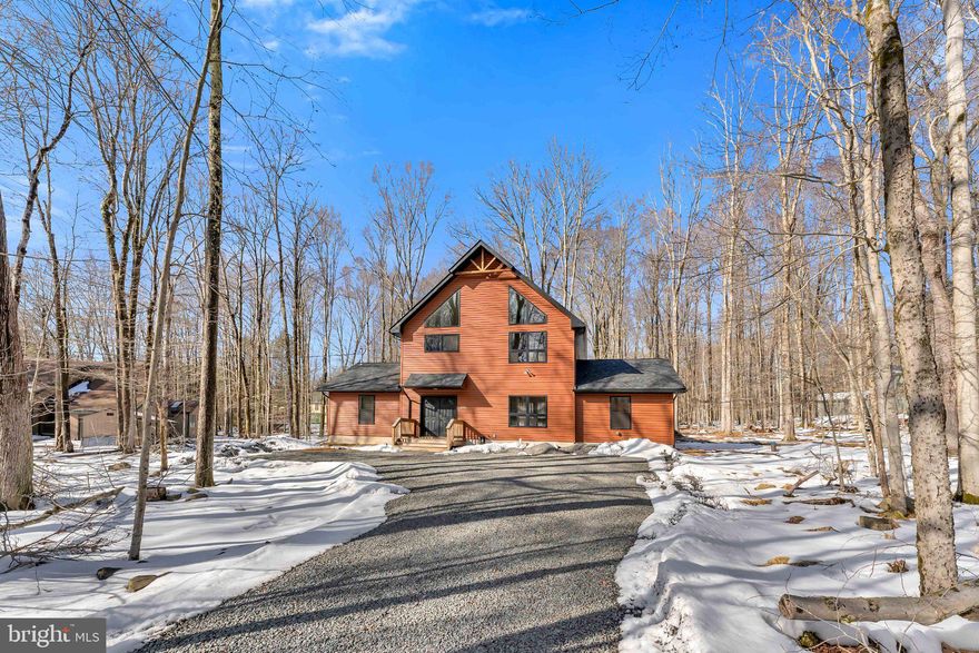 Welcome to Camelot Forest Conservation Preserve, where peaceful mountain living meets modern custom design. Built in 2022, this stunning custom two-story home showcases exceptional craftsmanship, thoughtful upgrades, and luxurious touches throughout. Step onto the spacious front porch and enter a bright, welcoming foyer filled with the fresh warmth of natural wood. The main level features a private primary suite complete with its own cozy fireplace and a beautifully designed spa-style bathroom with a soaking tub and separate shower complimented with a rain style shower head. A convenient laundry room off of the foyer and custom ski-style coat rack in the foyer add the perfect touch for Pocono living. Continue through the foyer into an expansive family/game room--an ideal space for entertaining or relaxing. From here you'll find access to the lower deck, additional bedrooms, a guest bathroom, and even a private custom sauna, creating the perfect retreat after a day enjoying the outdoors. Upstairs, the home opens into a breathtaking living space featuring cathedral ceilings, a warm fireplace, and dramatic chalet-style windows that flood the room with natural light while showcasing the surrounding forest views. Sliding glass doors lead to a large second-floor deck perfect for grilling, entertaining, or simply relaxing with a good book while enjoying the peaceful wooded surroundings. The open-concept kitchen is designed to impress with custom cabinetry, quartz countertops, floating display shelving, stainless steel appliances--including a stainless steel refrigerator and dishwasher--and a spacious breakfast bar. The adjoining dining area easily accommodates a 12-person table, making this home perfect for gatherings with family and friends. Large windows throughout the kitchen and dining areas allow you to enjoy views of local wildlife including deer and other forest visitors.

Additional features include luxury vinyl plank flooring throughout the home with carpeted bedrooms, custom lighting fixtures, abundant storage, and multiple outdoor living spaces designed to fully enjoy the beauty of Camelot Forest. The home also features a large gravel driveway with parking for approximately 6-8 vehicles and a Level 2 EV charger.

Located in a short-term rental friendly community, this property offers excellent flexibility for owners and investors alike.

This remarkable custom home offers the perfect combination of modern comfort, thoughtful design, and natural Pocono surroundings. A must-see property for buyers seeking something truly special.