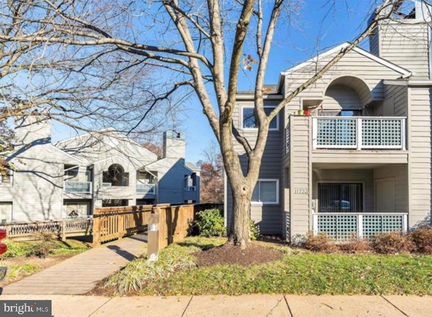 Under Contract - Open Houses Cancelled.  Lovely main level condo with no steps to front door or parking space.   Complete kitchen renovation featuring stainless appliances and quartz countertops, and new cabinetry,  Sliding glass door from breakfast area to balcony.  Flooring also redone at the same time and converted to LVP.   Bathrooms also remodeled in shades of white and gray.   Open floor plan with  ample. natural light from double windows,  Wood burning fireplace in living room.  Adjacent to North Point Village Center; walkable to Lake Newport pool, tennis courts trails.  10 min drive to Dulles Airport and close to Two Metro Stops in Reston