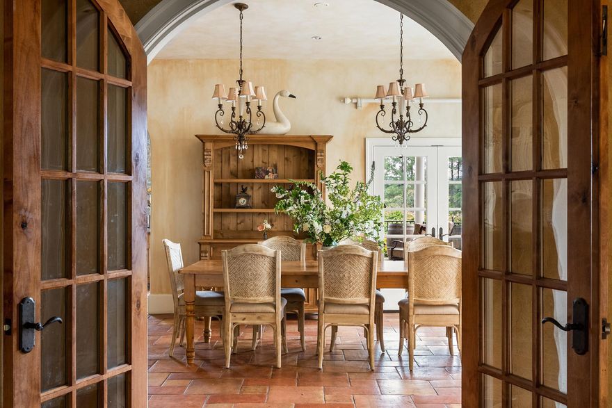 Perched majestically in Virginia's prestigious Hunt Country, "The Looking Glass" estate offers an unparalleled living experience across 30 breathtaking acres. Named for its sweeping panoramic views of the mountains and neighboring vineyard, this Tuscan-inspired masterpiece seamlessly blends old-world charm with modern luxury.

The magnificent main residence spans 17,000 square feet, with 11,000 square feet of meticulously designed living space on the first two levels and an additional 6,000 square feet on the lower level with room for further customization. Featuring five sumptuous bedrooms and ten elegant bathrooms, the estate creates an atmosphere of refined opulence through its exceptional construction and meticulous maintenance.

The exterior showcases a harmonious blend of stone and stucco, complemented by distinctive arched doorways and windows that define its architectural character. Inside, rich hardwood, natural stone, and luxurious marble flooring extend throughout, while wrought iron staircases add to the estate's old-world ambiance.

Outdoor entertaining reaches new heights with a heated pool and spa adjacent to an inviting pavilion featuring a stone terrace and outdoor fireplace—all overlooking the estate's stunning grounds and breathtaking vistas.

The property is further enhanced by a spacious 2,500-square-foot guest house offering four bedrooms, generous living spaces, and a full kitchen. Equestrian enthusiasts will appreciate the connecting eight-stall stable with its grand ceiling, convenient wash stall, and well-appointed tack room.

"The Looking Glass" represents an extraordinary opportunity to own one of Hunt Country's most distinguished estates.