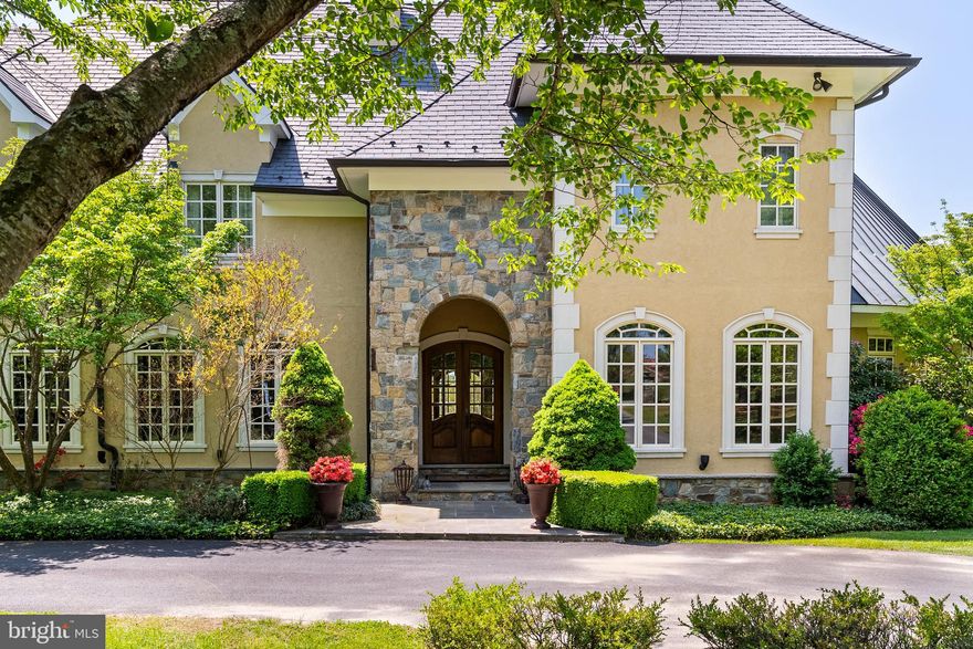 Perched majestically in Virginia's prestigious Hunt Country, "The Looking Glass" estate offers an unparalleled living experience across 30 breathtaking acres. Named for its sweeping panoramic views of the mountains and neighboring vineyard, this Tuscan-inspired masterpiece seamlessly blends old-world charm with modern luxury.

The magnificent main residence spans 17,000 square feet, with 11,000 square feet of meticulously designed living space on the first two levels and an additional 6,000 square feet on the lower level with room for further customization. Featuring five sumptuous bedrooms and ten elegant bathrooms, the estate creates an atmosphere of refined opulence through its exceptional construction and meticulous maintenance.

The exterior showcases a harmonious blend of stone and stucco, complemented by distinctive arched doorways and windows that define its architectural character. Inside, rich hardwood, natural stone, and luxurious marble flooring extend throughout, while wrought iron staircases add to the estate's old-world ambiance.

Outdoor entertaining reaches new heights with a heated pool and spa adjacent to an inviting pavilion featuring a stone terrace and outdoor fireplace—all overlooking the estate's stunning grounds and breathtaking vistas.

The property is further enhanced by a spacious 2,500-square-foot guest house offering four bedrooms, generous living spaces, and a full kitchen. Equestrian enthusiasts will appreciate the connecting eight-stall stable with its grand ceiling, convenient wash stall, and well-appointed tack room.

"The Looking Glass" represents an extraordinary opportunity to own one of Hunt Country's most distinguished estates.