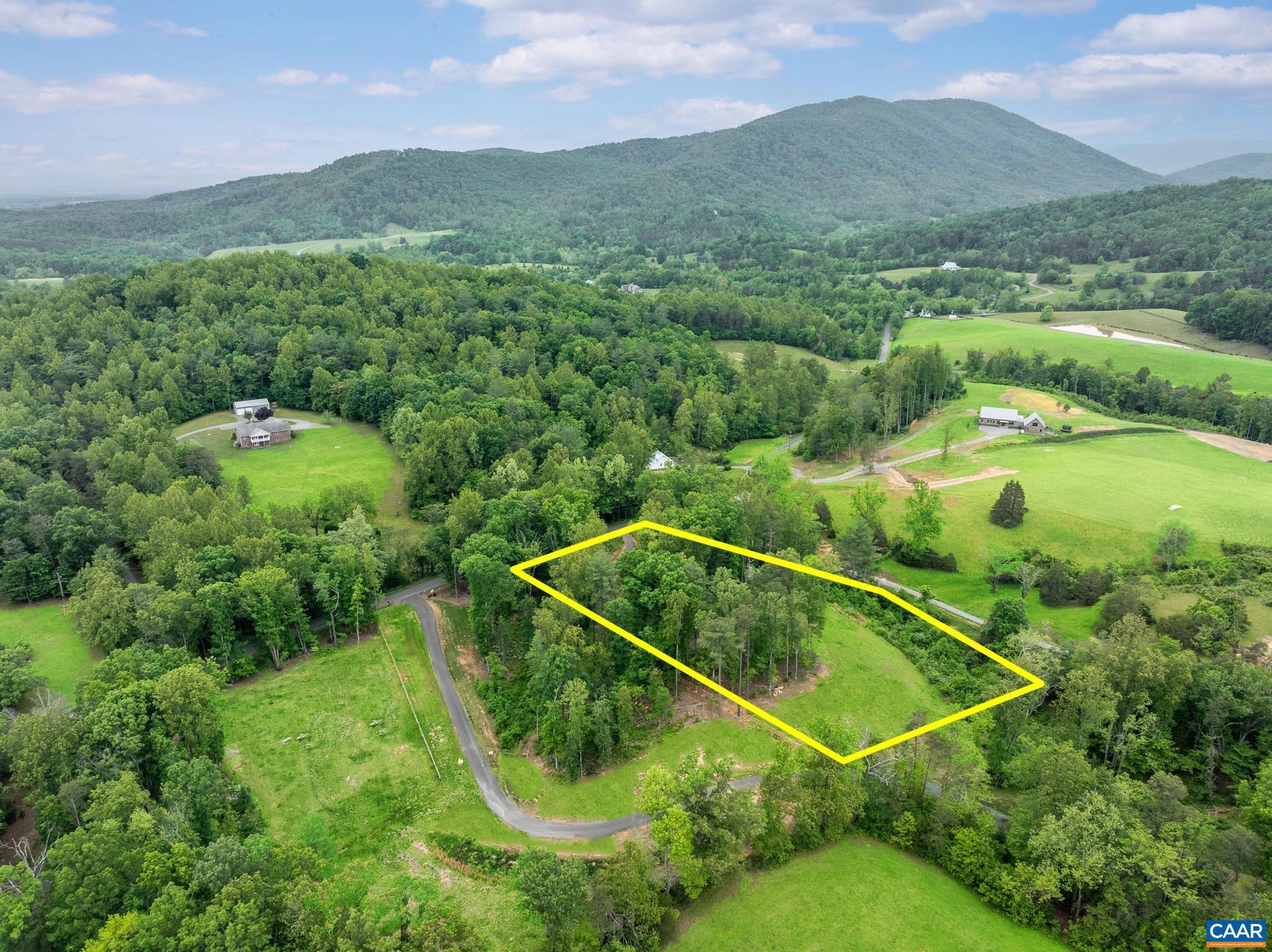 Broad, layered Blue Ridge Mountain views await! Year-round you'll have fantastic sunsets. The site is slightly elevated so that the views are ever present from ground level. You'll take Blue Ridge Road through one of the prettiest, most tranquil parts of Albemarle County. Whether as a permanent residence or get-away, you'll appreciate the amazing beauty found here. Because a few multi-million dollar homes are being built in the area, this is a also a great investment opportunity. Firefly Fiber Broadband provides all the internet speed you could need!