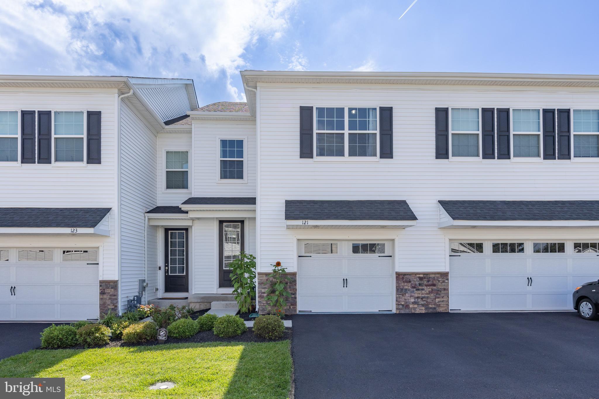 Only a job relocation makes this stunning Lennar built Southall townhome available for one lucky future homeowner. Welcome to 121 Golden Vale Dr, a breathtaking 3-bedroom, 3.5-bath townhome located in the highly sought-after Southall community in Limerick Township. Built in 2018, this beautifully maintained home offers the modern finishes and smart design you’d expect in newer construction, all within walking distance to the beloved Limerick Community Park and Manderach Playground—one of the area’s top public parks.
As you approach the east facing front door you'll find the front porch that leads you into the home. Step inside to find gleaming hardwood floors that flow throughout the open-concept main living level. The chef’s kitchen is a true standout, featuring crisp white shaker cabinets, granite countertops, stainless steel appliances, and a spacious center island that’s perfect for morning coffee or casual meals. The open floor plan allows you to stay part of the action while creating your culinary masterpieces in the kitchen. When building the home the seller thoughtfully added the breakfast nook bump out off of the eat-in kitchen area, providing valuable extra living space on all three levels of the home.
Upstairs, the primary suite serves as a peaceful retreat with a large walk-in closet and bonus cabinetry with added counter space for extra storage. The en-suite bathroom is equally impressive, offering a dual sink vanity and an oversized walk-in shower. Two additional bedrooms, a shared hall bath, second-floor laundry, and a spacious loft—ideal for a home office or reading nook—complete the upper level.
Downstairs, the fully finished basement with a full bath offers incredible versatility. Whether you need a home gym, media room, playroom, or guest space, this level is ready to meet your needs. If you hurry you'll still have time to fire up the grill and enjoy a backyard BBQ this summer! The Trex deck overlooks community open space with no other homes behind you. It's the perfect place to relax at the end of a busy day! Tired of having to find somewhere to park when you get home from work? No worries with that here! The extended 1 car garage offers plenty of space to park while still leaving garage space for your other toys! Need additional parking? The driveway provides an additional space as well. Having friends over? 2 separate overflow parking lots are just steps from your front door!
This home blends comfort, convenience, and lifestyle in one perfect package. While you will only be a short stroll to the walking trails, sports fields, and playgrounds at Limerick Community Park you are also just minutes to major roads, local employers and all of the shopping and dining options that this great area has to offer. Located in the sought after Spring-Ford School District, this home truly has it all. Don’t miss your opportunity to own a home in one of the most desirable communities in Limerick Township!