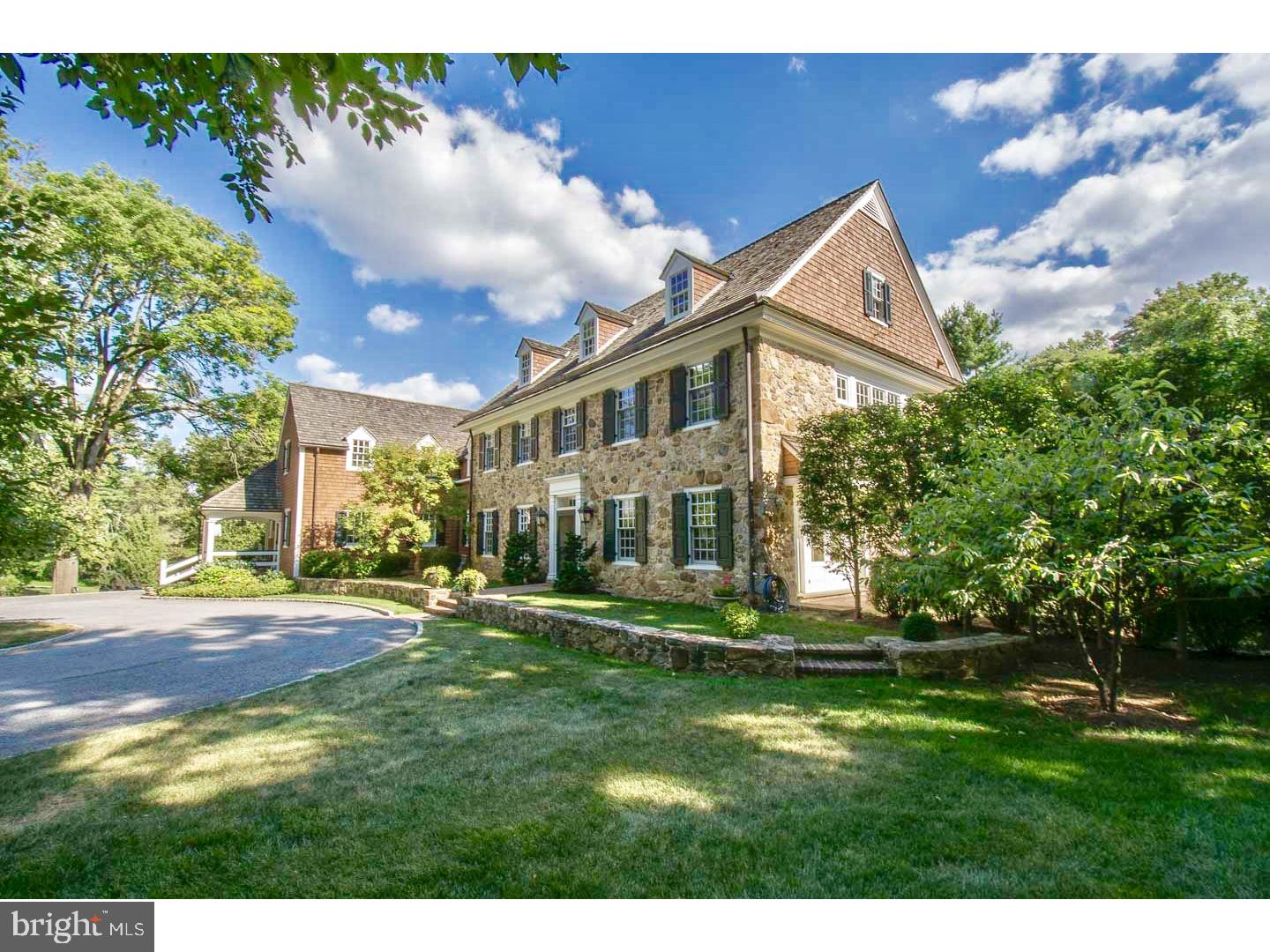 This extraordinary property is a magnificent and masterful work of art which represents to perfection the essence of the renowned architect Brognard Okie, and has captured that spirit in a new home of incomparable quality and character. Designed by Archer Buchanan Architects, this superlative property is an exceptional example of old world charm blended with the finest materials and craftsmanship available today. Meticulous on-site construction, Chester County field stone, salvaged wood, fixtures, hand cut stone and wrought iron from historic Chester Springs farmhouse, solid custom mahogany doors, cedar shake roofs and gorgeous bucolic property in one of Wayne's most desirable locations. Expansive and secluded backyard with salt water pool, three different outdoor patio areas, a covered porch with stone fireplace, and a deck with awning off of the MBR. Stunning interior designed to bring in light from every room: sweeping staircase, wide flowing entrances into each living area, extraordinary attention to detail in every aspect of this home as seen in rounded walls, intricate moldings and millwork, overwhelming sense of light and space, rooms that are spacious yet intimate, fabulous kitchen with high end appliances, soapstone and teak counters, custom made cabinetry, two farm sinks, two dishwashers, Butler's Pantry and much more. Amazing FR with corner FP and coffered ceiling, and all rooms have exits to patios. Beautiful MBR w/luxurious MBA, 2 walk-in closets, and door to private deck with awning. Add'l BRs, BAs and Exercise studio. Elevator from basement to 2nd fl. Detached 3 car garage with fabulous 2nd fl cottage with kitchenette, amazing studio and full BA. This is the quintessential old world Pennsylvania Farmhouse, true to its heritage and tradition, yet offering the amenities and luxury for today's lifestyle. Co-Buyer's Agent: Ron Baranzano, BHHS Rosemont.