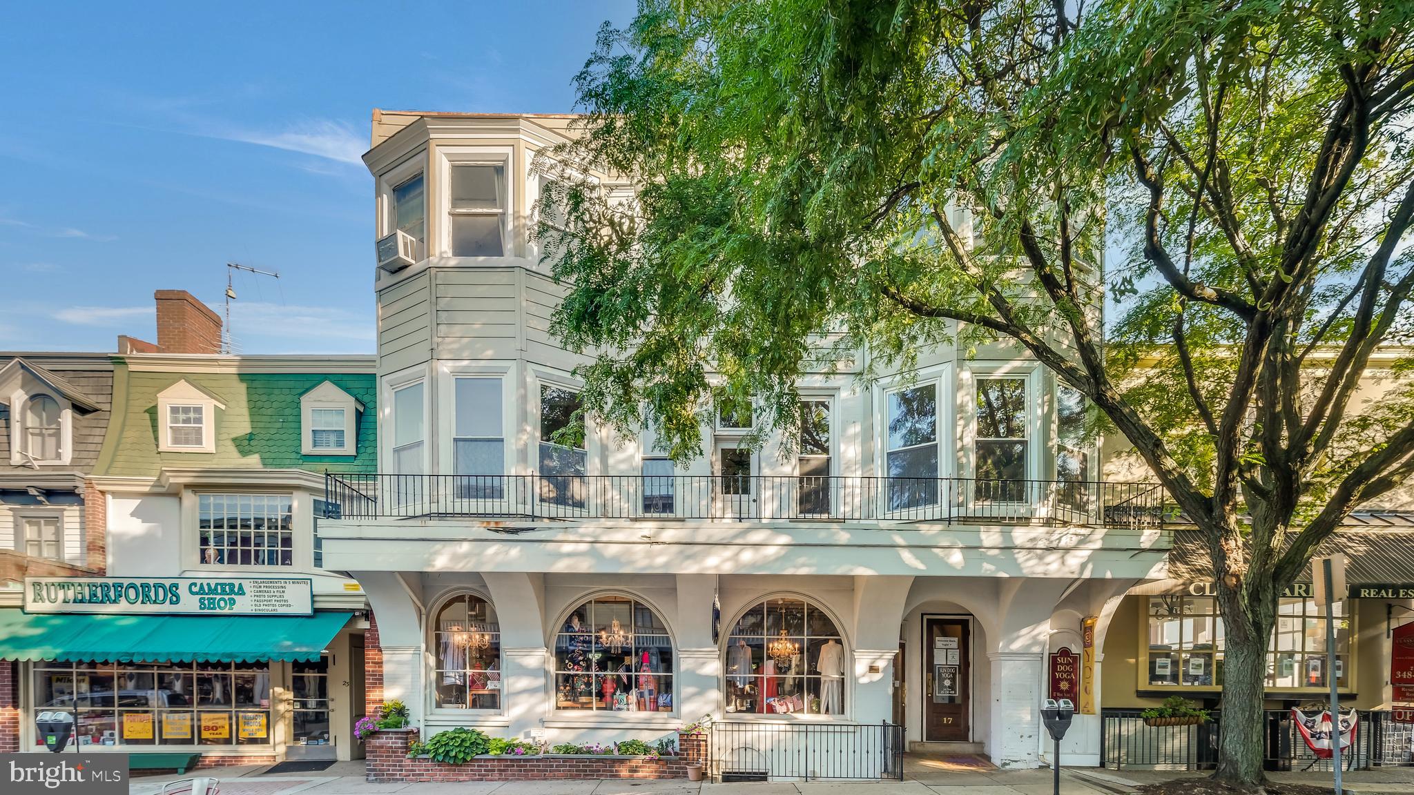Great opportunity to own a mixed use building in the heart of Doylestown Borough. There are three units that have separated heating/cooling and electric. The first floor is currently used as a clothing store, retail space offering front street parking access and rear parking lot(Kenny's Lot) access both able to accommodate wheel chair access. First floor has an open floor plan with beautiful hardwood flooring, detailed millwork on trim and ceilings, dressing and storage area and bathroom. The Second floor with long(10+ yr) term tenant is currently used as a Yoga studio. This unit is also in great shape, nicely appointed and offers a kitchen area, 2 bathrooms and storage room. The Third floor is a residential 3 bedroom apartment which has large Living room with deck access, Office, galley Kitchen, dining area also with access to the deck over looking Doylestown, and 2 Full bathrooms. This building would be ideal for owner occupant running a business on the first floor and having 2 additional units with income. Architectural Drawings and Virtual Tour availible upon request.