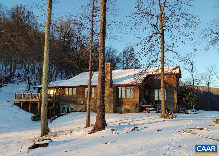 Priced $50K below appraisal. Luxury mountain living on 22 acres bordering George Washington & Jefferson National Forests. 2 main-level primary suites, 5.5 baths, and a finished 1,700 sq ft walkout basement with a kitchenette and full bath. Vaulted great room with pine floors, massive dining room seating 12-16, renovated chef?s kitchen with quartz countertops, two stone fireplaces with new inserts. The home offers modern comforts including a whole-house generator, wheelchair lift, dumbwaiter, and dual water sources with filtration. Income potential is boosted by a $5,000/year lease on an internet tower providing free high-speed internet. Near Crabtree Falls, Wintergreen Resort, Blue Ridge Parkway, several colleges, and local breweries.,Wood Cabinets,Fireplace in Basement,Fireplace in Great Room