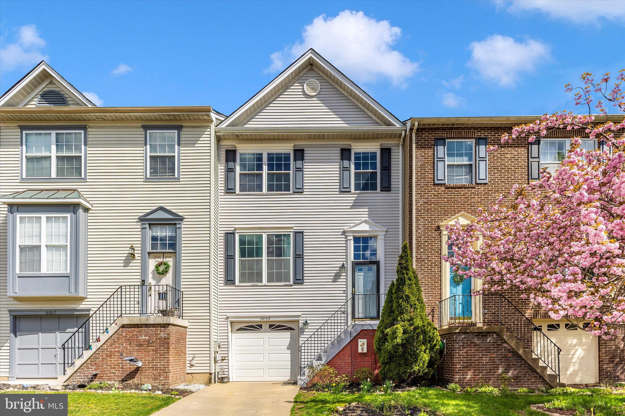 Welcome home to 6069 Flagstone Court! This wonderful 3 bedroom 2 full bath, 2 half bath townhome, in the highly desirable Spring Ridge community is just waiting for you to call it your very own! The main level of your home offers your spacious living room with cozy three-sided fireplace, kitchen and dining area plus a guest half bath. The upper level of your home offers your primary bedroom with walk-in closet and private full bath, plus two secondary bedrooms and full hall bath. The lower level of your home offers a rec room with walk-out, additional half bath, laundry, and convenient access to your one-car garage. The home also offers a rear deck and fenced backyard. In addition to everything you can see the home also offers a newer roof (2020) and newer HVAC system (2022). All of this in a wonderful community offering fantastic amenities including pools, playgrounds, soccer fields, miles of walking paths and more, while just minutes from shopping, dining and major commuter routes. Don't miss your chance to call this wonderful house your next home!
