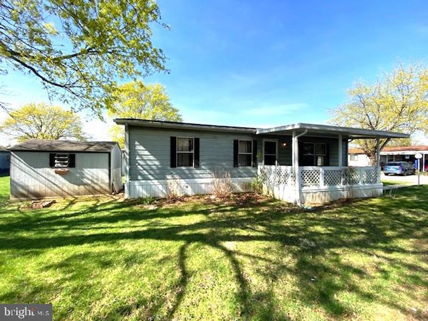 Spacious Skyline double wide mobile home in Green Acres, located in the highly desirable Parkland School District! This 2 bedroom home boasts a new roof in 2023 and a newer furnace. The large covered front porch leads into a spacious living room. The kitchen boasts a wrap around counter and a nice sized dining room with rear entry/exit to back porch and 3 car off street parking pad. Two generously sized bedrooms and full bathroom. Central A/C. Plus, enjoy access to fantastic community amenities like a pool, park, and community center. The home will need a little TLC such as new carpets but you can’t beat the price!
