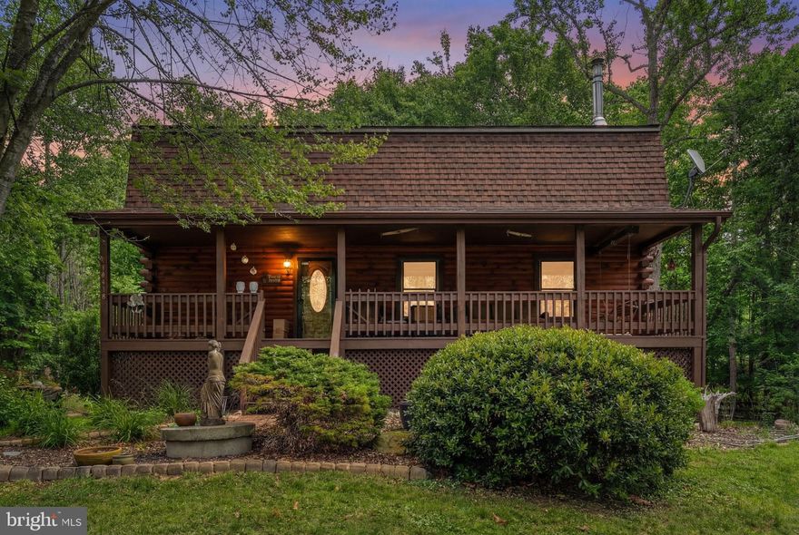 *VA 2.2% Assumable Loan Available* Low Energy Bill- Avg $158/month*2,973 sqft of Living Space*Lower Level Suite with Full Kitchen, Bath, Living Room, Bedroom and Private Walk Out Entrance!

Spring has Sprung!  Escape to the country and explore the trails and this enchanting Log Home!

Nestled in a serene rural setting, this beautifully renovated log home offers the perfect blend of rustic charm and modern comfort on 8.16 private acres with 2,973 square feet of living space. Major updates including new roof(s), freshly stained exterior logs on both the home and garage, fireplace lining, main level luxury bathroom with custom vanity, and other updates have transformed the home into a warm, inviting retreat featuring soaring two-story ceilings, exposed wood beams, and hardwood flooring.

The open living area flows into a kitchen with granite countertops and deck access—ideal for entertaining or enjoying peaceful country views. A main-level bedroom provides easy one-level living, while two additional bedrooms are located upstairs. The fully finished walkout lower level offers a private in-law suite with separate entrance, complete with a full kitchen, full bath, bedroom, and spacious living and dining area—perfect for guests or multi-generational living.

Outside, enjoy a full covered front porch overlooking neighboring open pasture, abundant wildlife, and scenic vistas, along with the soothing presence of a nearby creek. The level, partially cleared land includes a fully fenced flat acre ideal for animals, with access to walking paths, and riding trails. A detached oversized garage with large overhang provides ample storage or animal shelter.

Located on a no-thru street with a private driveway and abundant gardens, this property delivers true peace and quiet while remaining conveniently accessible to nearby amenities. This is more than a home—it’s a lifestyle defined by space, privacy, and timeless country living.