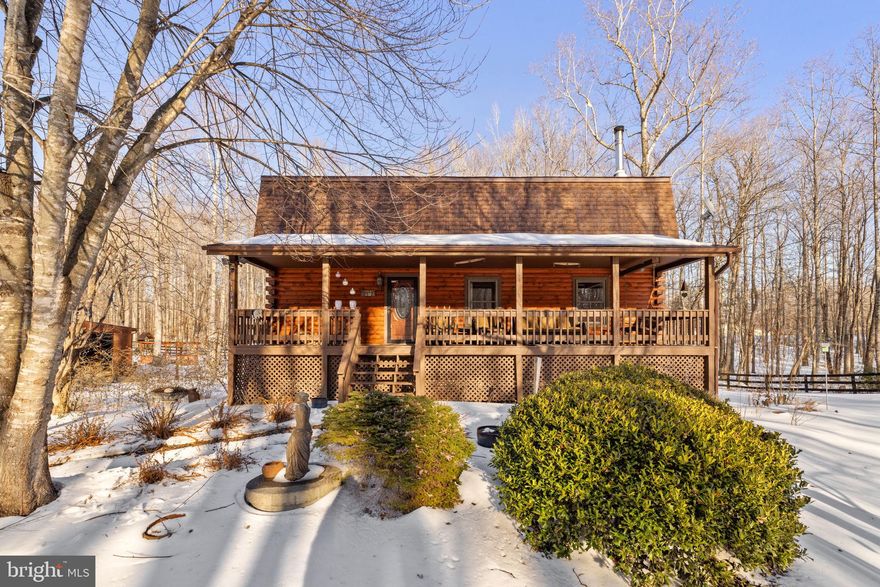 *VA 2.2% Assumable Loan Available* Low Energy Bill- Avg $158/month*2,973 sqft of Living Space*Lower Level Suite with Full Kitchen, Bath, Living Room, Bedroom and Private Walk Out Entrance!

Nestled in a serene rural setting, this beautifully renovated log home offers the perfect blend of rustic charm and modern comfort on 8.16 private acres with 2,973 square feet of living space. Major updates including new roof(s), freshly stained exterior logs on both the home and garage, fireplace lining, main level luxury bathroom with custom vanity, and other updates have transformed the home into a warm, inviting retreat featuring soaring two-story ceilings, exposed wood beams, and hardwood flooring.

The open living area flows into a kitchen with granite countertops and deck access—ideal for entertaining or enjoying peaceful country views. A main-level bedroom provides easy one-level living, while two additional bedrooms are located upstairs. The fully finished walkout lower level offers a private in-law suite with separate entrance, complete with a full kitchen, full bath, bedroom, and spacious living and dining area—perfect for guests or multi-generational living.

Outside, enjoy a full covered front porch overlooking neighboring open pasture, abundant wildlife, and scenic vistas, along with the soothing presence of a nearby creek. The level, partially cleared land includes a fully fenced flat acre ideal for animals, with access to walking paths, and riding trails. A detached oversized garage with large overhang provides ample storage or animal shelter.

Located on a no-thru street with a private driveway and abundant gardens, this property delivers true peace and quiet while remaining conveniently accessible to nearby amenities. This is more than a home—it’s a lifestyle defined by space, privacy, and timeless country living.