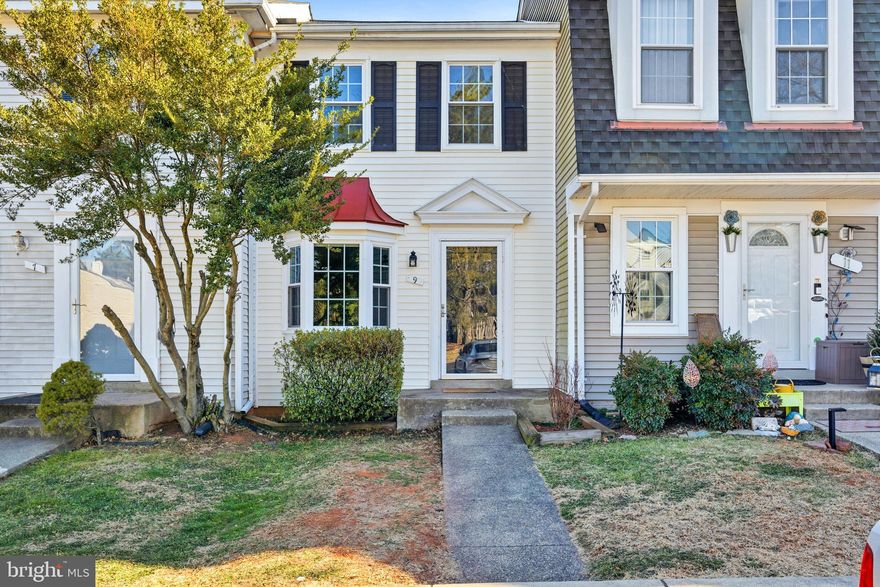 Welcome to this thoughtfully laid out and beautifully maintained three-level townhome, offering comfort, style, and modern updates throughout. Hardwood floors grace the main level, where a large bay window fills the space with natural light and creates a warm, welcoming atmosphere. The updated kitchen is a standout, featuring granite countertops, stainless steel appliances, refreshed and painted cabinetry, classic 12x12 tile floors, and a charming eat-in area perfect for casual meals or morning coffee. Sliding glass doors provide easy access to the deck, making indoor-outdoor living effortless.

Step outside to a fully fenced backyard with a grassy area and a lower-level patio, all backing to peaceful common space views. Whether you're relaxing on the deck or enjoying the outdoors from the yard, this home offers an inviting retreat.

Upstairs, two well-proportioned bedrooms share a beautifully updated hall bathroom with modern finishes. The walk-out lower level is filled with natural light and offers excellent flexibility, ideal for a recreation room, guest space, or comfortable home office. Thoughtful built-ins add smart, space-saving storage, while a full bathroom, dedicated laundry area, and ample additional storage enhance everyday functionality.

Recent improvements include newer windows, siding, roof, HVAC system, deck, and dishwasher, contributing to improved energy efficiency and long-term peace of mind. Carefully maintained and thoughtfully updated, this home is located in an amenity-rich community within a highly rated school district and offers convenient access to major commuter routes, shopping, dining, and entertainment. A wonderful opportunity to enjoy comfortable, low-maintenance living in a move-in ready home.