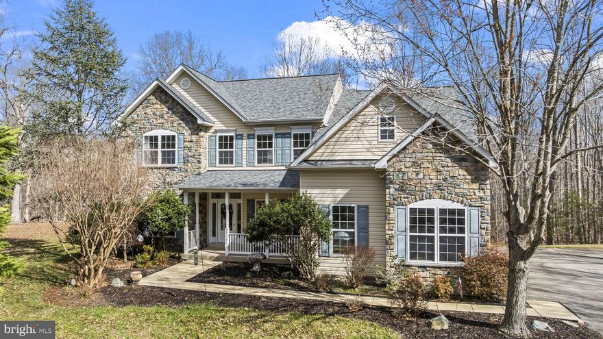 This private 2.58-acre property is surrounded by mature trees, offering a peaceful and secluded setting. The impressive colonial home features an open floor plan with spacious rooms across all three levels, designed for both comfortable living and entertaining. 
The main level welcomes you with a dramatic two-story foyer and features a wide-open layout, including a formal dining room and a living/music room, both accented with tray ceilings, crown molding, and wainscoting. The generously sized family room, enhanced by a 4-foot bump-out, flows seamlessly into the kitchen and eat-in area​.  A main-level primary suite provides the perfect space for an in-law or au pair. 
​The upper level ​overlooks the 2-​ story foyer, and b​oasts the luxurious primary suite, ​with vaulted ceilings, a dressing room, soaking tub, dual sinks, a​ separate shower, and expansive owner’s closets​. The two other spacious bedrooms share a hallway bathroom.
The walkout lower level is filled with natural light and offers incredible versatility, featuring a spacious family room, a large bonus room perfect for a bedroom or office, a full bathroom, a kitchenette, and additional space for a game room or recreation area.
Additional highlights include custom drywall with rounded corners, granite countertops, ​a large kitchen island with seating area, stainless steel appliances, a gas stove, a large walk-in pantry, vaulted ceilings,  hardwood floors, a beautiful stone front, and a covered front porch.
Step outside to the expansive Trex deck—ideal for entertaining, grilling, or simply relaxing while enjoying the serene surroundings.