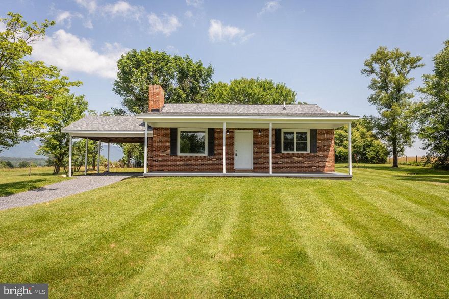 Move-In Ready Brick Ranch on 1.69 Acres with Stunning Mountain Views  Fully Renovated from Top to Bottom!

This is the one you’ve been waiting for — a rare opportunity to own a fully updated all-brick home on nearly two acres of peaceful countryside, just minutes from downtown Luray, public river access, and the world-famous Luray Caverns.

 Inside, the home has been thoughtfully renovated to offer both charm and modern comfort. The bright, open kitchen is outfitted with brand new Aristokraft soft-close cabinets, granite countertops, a large undermount stainless sink, and brand-new stainless-steel appliances. The spacious living room features refinished hardwood floors, a fresh neutral paint palette, and a white brick fireplace that anchors the space beautifully. The bathroom has been completely renovated with a new tub and surround, updated vanity, modern fixtures, and luxury vinyl plank flooring. Both bedrooms are generously sized and feature all new carpet.

Every major system has been thoughtfully upgraded to ensure long-term comfort. The home boasts a brand-new architectural shingle roof with a 50-year material warranty, new vinyl double-hung windows, all-new exterior and interior doors, and a new 200-amp electrical service. Comfort and efficiency are further enhanced by a new HVAC system and ductwork (with a 10-year material warranty), a new hot water heater, and a new well pump and pressure tank.

A full unfinished basement offers exceptional potential for future expansion, workshop space, or storage. The property also features an attached carport, a large covered front porch, and a gently rolling 1.69-acre lot that’s ideal for relaxing, expanding, or creating your own homestead. With Agricultural zoning, you’ll have the freedom to garden, raise animals, or even build onto the home over time — all while enjoying the privacy, space, and flexibility that rural living provides.
 
Whether you're a first-time buyer, retiree, or someone simply looking to escape to nature without sacrificing quality or convenience, this home delivers. Properties with this level of renovation, land, and long-term livability don’t hit the market often—schedule your showing today before it's gone!

 (Some photos may contain virtual staging.)