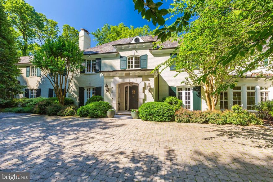 Very rarely does a home come on the market in Potomac with such an idyllic setting overlooking a private nine acre lake area. This home has, over the years, had two additions which blend seamlessly to the original W. C. & A. N. Miller home to take full advantage of the magnificent view from all levels.. The high level of detail in the last renovation is evident in the millwork. Notice the recurring arch theme throughout the home.  (And there are three secret / hidden doors)The award winning gourmet kitchen was renovated by Bowa Builders in 2015 and is a chef's dream. The kitchen flows into the large family room and out to an expansive screened-in porch, overlooking the pool and lake. On this level there is also an elegant living room with high ceilings, dining room with a gas fireplace, cozy library, and a mudroom which accesses the 4-car garage. Apart from the custom designed, two story, curved main staircase, there are two separate staircases leading to the upper level. All 3 levels could be accessed by an elevator, as there is an elevator shaft in place for future use. On the upper level there are 5 bedrooms, an office, a craft room, and a washer/dryer hook-up. The walkout lower level boasts an exercise room with high ceilings, recreation room with fireplace, large entertaining refreshment center w/ French doors accessing the patio and backyard, and a large laundry room. The yard is a gardener's dream with many flagstone walkways and stone walls. The pool is surrounded by a very large flagstone deck which would easily accommodate a large outdoor party. It is further enhanced by a built-in fire pit surrounded by a curved stone wall which overlooks the lake. This remarkable home is a must see  to be fully appreciated! To view video tour go to http://vimeo.com/426279250.