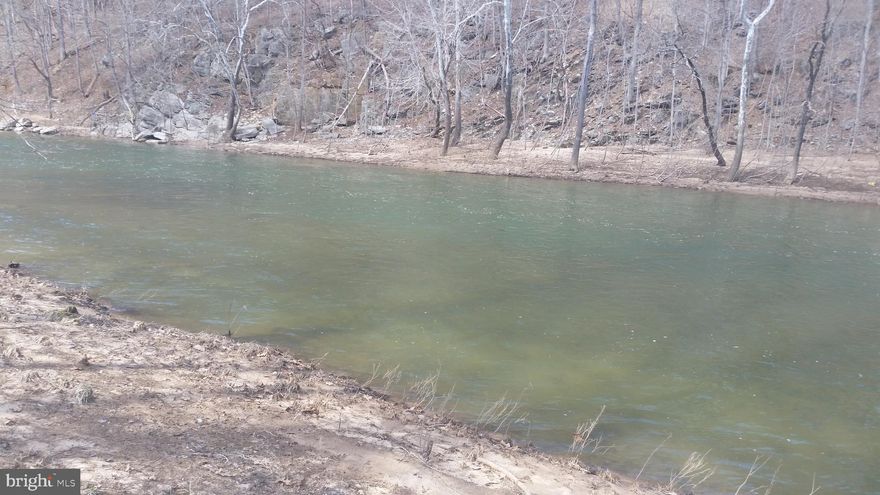 Beautiful Cacapon River Front Lot, Nice deep water for swimming, fishing and boating. Meadow area outside of flood plain for that long awaited mountain retreat. Come out and take a look, Call Today!