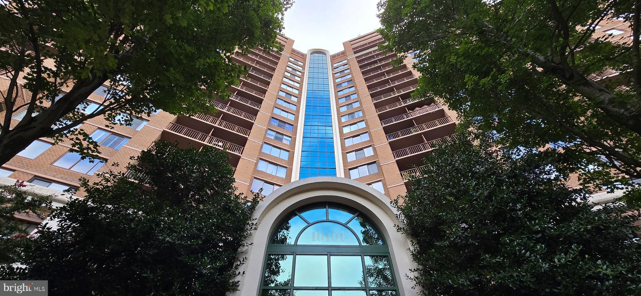 Discover the perfect blend of modern elegance and convenience at 10101 Grosvenor Pl #817, a stunning condominium located on the 8th floor in the heart of North Bethesda, MD. This contemporary residence features an airy open-concept layout with expansive windows that fill the spacious living and dining areas with natural light while offering treetop views. The chef’s kitchen is equipped with sleek stainless steel appliances, granite countertops, and a breakfast bar for casual dining. The serene primary bedroom boasts a walk-in closet and a luxurious en suite bathroom, while a private balcony provides the ideal spot to enjoy peaceful morning coffee or evening relaxation. Additional comforts include in-unit laundry, hardwood floors, newly replaced blinds, and reserved parking. Residents enjoy a full suite of amenities such as a 24-hour concierge, fitness center, community room, outdoor pool, dog park, and sports courts. With the Grosvenor-Strathmore Metro Station just steps away, downtown Washington, D.C., and beyond are easily accessible. Experience refined living at its best with this exceptional North Bethesda residence.