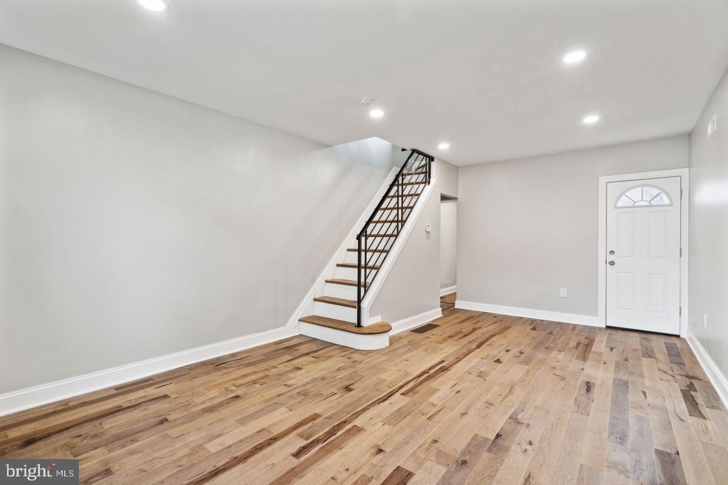 Welcome to this charming 2-bedroom, 1-bath home in Port Richmond. As you enter, you'll immediately notice the elegant hardwood floors and recessed lighting that extend throughout the home, enhancing its modern appeal. The first-floor living room is bathed in natural light, creating a bright and inviting space perfect for relaxation and entertaining. A dedicated dining area seamlessly connects to the kitchen, which boasts quartz countertops, stainless steel appliances, and a stylish custom backsplash. Upstairs, the first bedroom features an extended closet for ample storage, while the full bathroom offers a stand-up shower with a tiled surround. The sizable primary bedroom completes the second floor, providing a comfortable retreat. This home combines modern comforts with thoughtful design, making it a perfect choice for your next move.