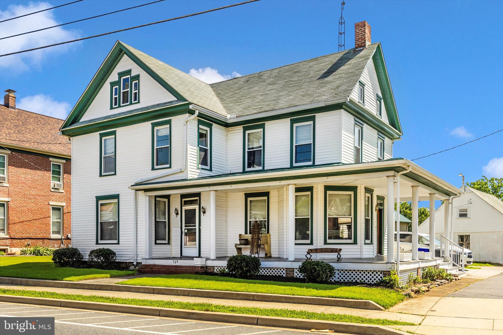 Step back in time into this Gracious home. Wrap around maintenance free porch invites you to sit and stay awhile. Gorgeous refinished wood floors, original mantels and a staircase that compliments this home's grace will charm you. Much of the original beauty of this home still remains while modern updates offer convenience. Home offers the opportunity to live on one floor and lease the other. Or you can easily return it to a single family home with two staircases and 4 bedrooms. This home has been meticulously cared for which shows off it's history. All of this is enveloped in a large plush yard and comes with a three car detached side load garage complete with attic. Close to schools, library, Musket Ridge golf course and and easy jump to the interstate making your commute easy.