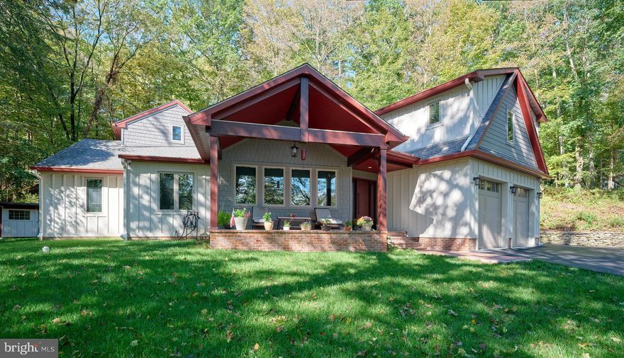 Totally reimagined ranch in Washington Crossing, this one-of-a-kind property is a blend of functionality and cutting-edge modern luxury. Artfully expanded and completely renovated into a sophisticated transitional-style featuring two distinct wings, it is at the pinnacle of "no-detail-overlooked" craftsmanship both inside and outside. Defined by a bright, open floor plan that flows effortlessly into a European-style kitchen featuring  sleek imported cabinets, quartz countertops and a high-performance suite of Bosch appliances, including the premium Benchmark series refrigerator and Ilve gas stove. The adjacent dining area includes a wood-burning fireplace that adds warmth and character to the contemporary layout. The kitchen provides direct access to a versatile three-season room; The left wing features a spectacular main bedroom suite and its own spa like bathroom and private loft with a  dedicated custom closets room/dressing room. A second spacious bedroom is serviced by a well appointed hall bath.  A second wing is accessed by its dedicated staircase; providing a “home within a home" feel, ideal for multi-generational living. Large third bedroom with its own custom closets and a bonus room; flexible space for a nursery, exercise room or a quiet office. The large mechanical room features washer dryer with sink and leads to the attached two car garage. Outside, a large shed has dedicated space for tools and wood storage . Across the street is the bridge with public access to the Towpath. Easy access to nearby 295, close to New Hope and Lambertville,  less than 40 minutes from Philadelphia.  Located within the highly rated Council Rock School District North. This exceptional property combines the comforts of a ranch with the magnitude of a home.