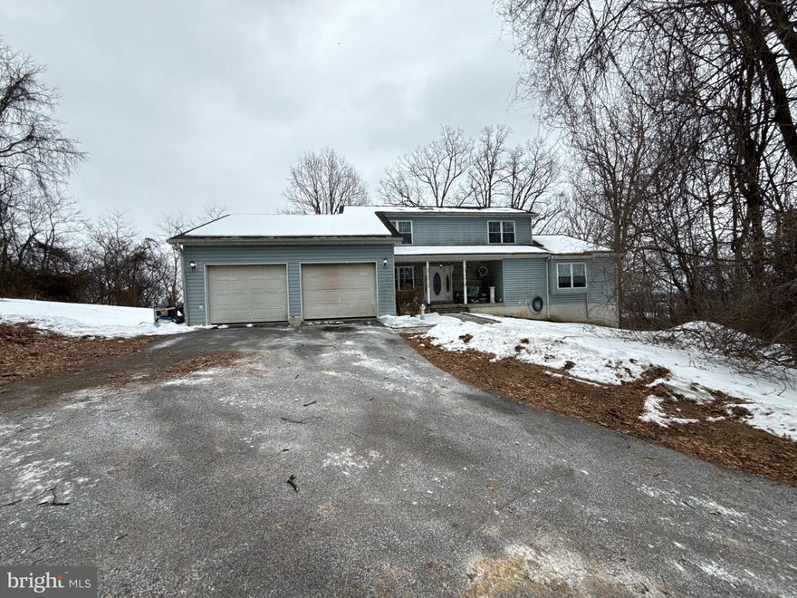 PRO PHOTOS COMING SOON

Opportunity awaits on 5.06 scenic acres in beautiful Hedgesville! This nearly 4,000 sq ft colonial home offers incredible potential for the right buyer ready to restore it to its full glory. With 5 bedrooms and multiple spacious living areas—including both family and living rooms—there’s no shortage of space to reimagine and customize. The main-level primary suite features a private Florida room, creating the perfect retreat to enjoy peaceful mornings and mountain views.

The fully finished basement previously offered two additional bedrooms and a full bath, but an HVAC leak resulted in flooding and repairs will be needed. The price reflects the work required, making this a compelling opportunity for investors, renovators, or buyers looking to build sweat equity in a prime setting.

Additional highlights include a 2-car attached garage, an extensive Water Filtration system, no HOA but has deed restrictions, and breathtaking mountainous views that provide privacy and tranquility. With solid bones, generous square footage, and over five acres to call your own, this property is ready for its next chapter. Bring your vision and transform this diamond in the rough into something truly special.