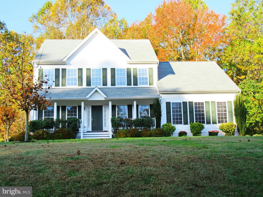 Beautiful Colonial in Breezy Point Estates with water privileges to fantastic Breezy Point Beach! Open Floor plan, kitchen w/ table space, wall oven, side by side fridge. Sep DR, Formal LR. Fam Rm off kit w/FP and Doors to deck overlooking priv yard backing to woods . Mstr Suite & lux bath w/soak tub, sep shower and dble vanities..  Walking dist to beach, playground and pier. Award Winning Schools