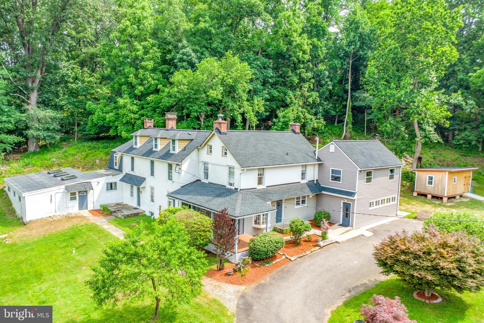 18th-century history meets modern luxury. This nearly 3 acre estate in Media, offers is 5,000+ SF with 6 bedrooms, five bathrooms including a separate beautiful office space with large conference or showroom. Perfect for the professional looking for a home office, an attorney, accountant, architect, designer, builder, contractor, landscaper etc. The property includes parking for over 20 vehicles with significant frontage on Route 1 just southwest of Media, a large shed for storage and is located within the award-winning Garnet Valley School District. The home was originally granted by William Penn, once the vacation residence of the Wawa family and later home to the Darlington Fine Arts Center, the property is rich in legacy while offering contemporary versatility with both residential and commercial use.
Inside, original herringbone wood floors, custom trim, deep-set windows, and three fireplaces blend seamlessly with updated amenities. The kitchen includes an expansive island, cozy fireplace, and a stunning original fieldstone wall, opening to a private backyard and patio. Additional spaces include a TV or playroom, vaulted ceilings, custom built-ins, generous closets, and a partially finished attic with potential for further expansion.
Recent improvements include a new roof with 50-year warranty installed in 2020, waterproofed basement completed in 2023, updated electrical system, renovated bathrooms, several new windows and skylights, a 12 by 18 shed added in 2023, and new vinyl siding on the office wing in 2024. A four-zone hydronic heating system offers year-round comfort.
Located near the Wawa Regional Rail Station with convenient access to major routes including I-95 and the Blue Route, this one-of-a-kind property offers a rare opportunity. Contact Listing agent for more information or private showing!
