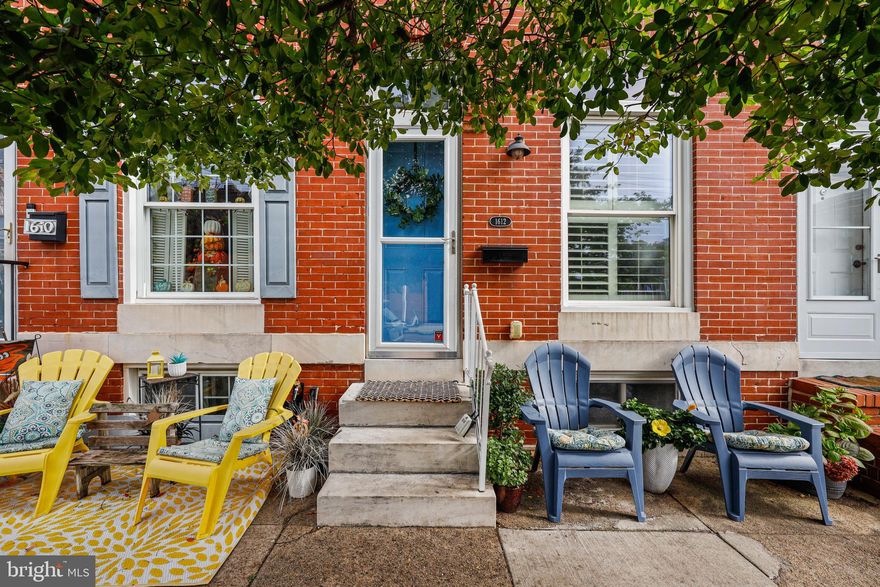 Welcome to 1612 East Clement Street, a charming and well-appointed home in the heart of Locust Point. This residence offers an inviting living room featuring exposed brick, hardwood flooring highlighted by recently installed recessed lighting. The kitchen is equipped with stainless steel appliances, including a gas range, stylish backsplash, and breakfast bar seating and is illuminated by recessed and pendant lighting, creating a warm and welcoming atmosphere. Conveniently located on the main level, the laundry area adds to the home's practicality. The dining area is bathed in natural light from skylights and a large picture window, with easy access to the rear parking pad. A half bath on the main level adds to the convenience. Upstairs, you'll find two spacious bedrooms. The primary bedroom boasts carpeting, a ceiling fan, and a large walk-in closet, while the second bedroom features carpeting, a large wall closet, and a ceiling fan. The highlight of this home is the private rooftop deck, offering stunning views of the city, perfect for relaxing or entertaining. The lower-level recreation room, with newer carpeting, provides ample space for games or movie nights and the addition of a half bath provides convenience. Updates to this home include, an updated kitchen backsplash, new range, new refrigerator and new water system, recessed lighting in the living room as well as carpeting and the addition of a half bath in the lower level. This home is ideally located near shopping with Southside Marketplace just a short distance away as well as an abundance of Dining options. Outdoor enthusiasts will appreciate the proximity to Latrobe Park, Riverside Park and Ft McHenry National Park. With its modern amenities, convenient location, and charming features, 1612 East Clement Street in Locust Point is a must-see property! Don’t Miss it!