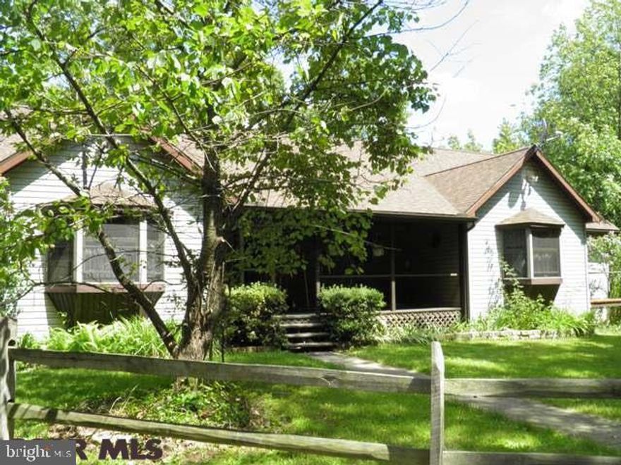 Secluded Ranch Home with log look interior on 12+ acres. Located 15 minutes from Lock Haven University and 30 Minutes to Penn State. Interior has open floor plan with two story fireplace in center of house, stunning hardwood floors, over sized hallways for handicap accessibility, two loft rooms connected by walk way open to lower level and roughed in plumbing for 3rd bath, new high-end master bath with jetted tub, tile shower and over sized windows looking out to woods, new furnace, new roof, and new water filtration system. Basement is ready for new owner to finish to their taste with sliding glass doors to exterior. Exterior has one deck with screened outdoor living space and second deck off of formal dining room for additional entertaining space, rustic fence, large yard and woods with large oaks ready to be timbered. Year round living or great second home get-a-way!