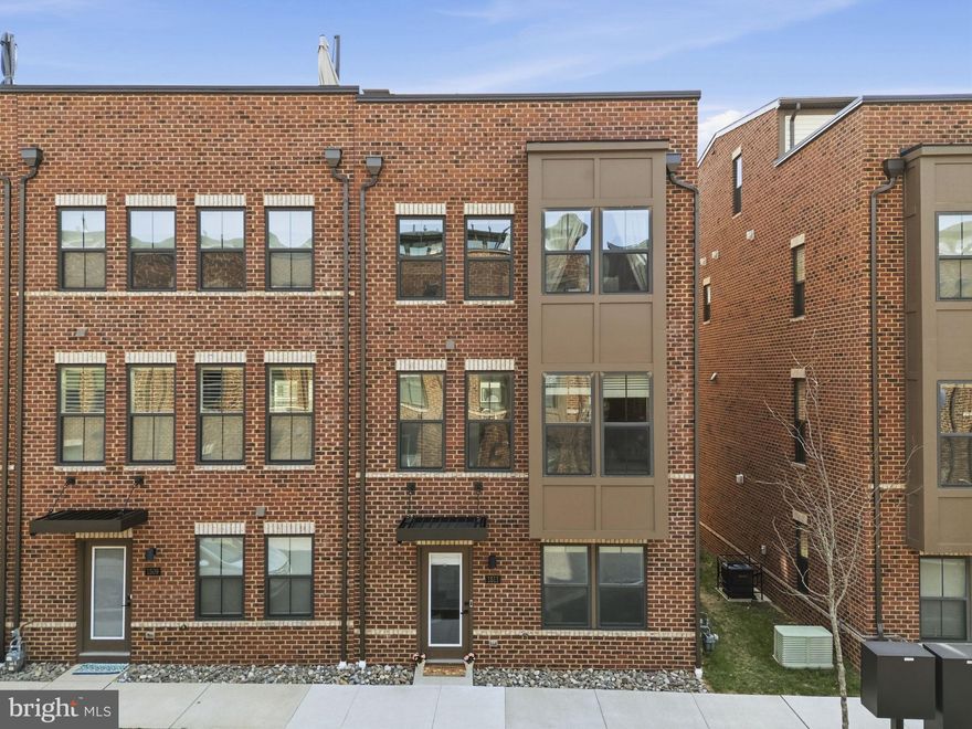 Welcome to Banner Row, Locust Point’s newest townhome community. If you've been looking for space to spread out and easy parking all while being in the heart of Locust Point, this is the perfect home for you. Pull into your two car garage that provides entry right into your first floor. Also on the first floor is a bedroom and private bath plus extra storage. This makes a great guest room or office/den space.

The main level features an open-concept floor plan with an oversized kitchen and island that flows into a bright living room, ideal for entertaining. The main floor also has a sitting/flex area and separate dining space, a custom built in coffee/appliance bar and access to your private balcony for morning coffees and evening grilling. This home is a sought after end unit which means a ton of natural light coming from three sides plus a bump out in the front providing even more space for living.

Upstairs, the primary suite includes a large walk-in closet, and spa-like bath with soaking tub, separate shower and dual vanities. Two additional bedrooms, a full bath, and second-floor laundry complete the third level.

The fourth level loft offers additional living space with a full bath, perfect for a home office or recreation room complete with custom wet bar. Best of all, it opens up to a rooftop terrace- perfect for summer nights and sunset views.

Enjoy a walkable location near McHenry Row with groceries, salons, gyms, and restaurants all nearby. Conveniently located to Federal Hill and the Baltimore Peninsula. Recreation, cultural attractions, and sports venues—including Fort McHenry, the National Aquarium, Camden Yards, and M&T Bank Stadium—are all within easy reach. This home combines modern design, functional space, and unbeatable location—perfect for enjoying the very best of city living.