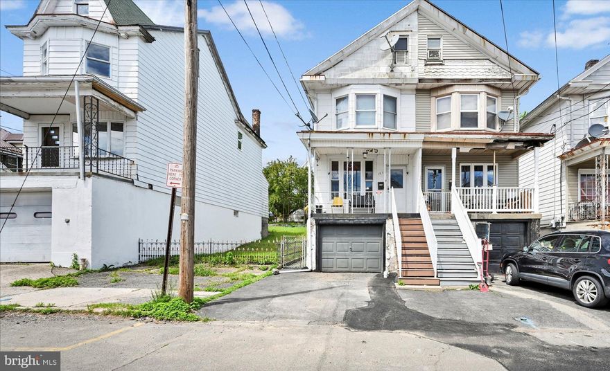 Semi-detached charmer looking for its new owner! Check out this home located in Shenandoah Heights! Plenty of room to breathe with 3 bedrooms as well as 2 rooms on 3rd floor that could easily be converted to additional living space. Generous living/dining room combo, eat-in kitchen with access to rear porch and fenced-in yard. Enjoy the convenience of the basement garage during those cold winters plus an additional off-street parking space. Oil heat and all appliances included. Don't pass this one by!