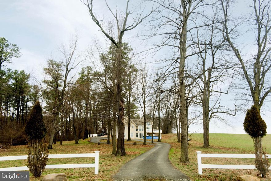 Beautiful contemporary custom-built home on just under 11 acres of land that can be subdivided. This home has 5 bedrooms, 3.5 baths, 2 car oversized garage. Gormet kitchen. Lower level is perfect in-law suite with  family  room, two bedrooms, full eat in kitchen , 1.5 bath, office & additional  game or family room.   Enjoy the abundance of nature and wild life the wrap around deck.