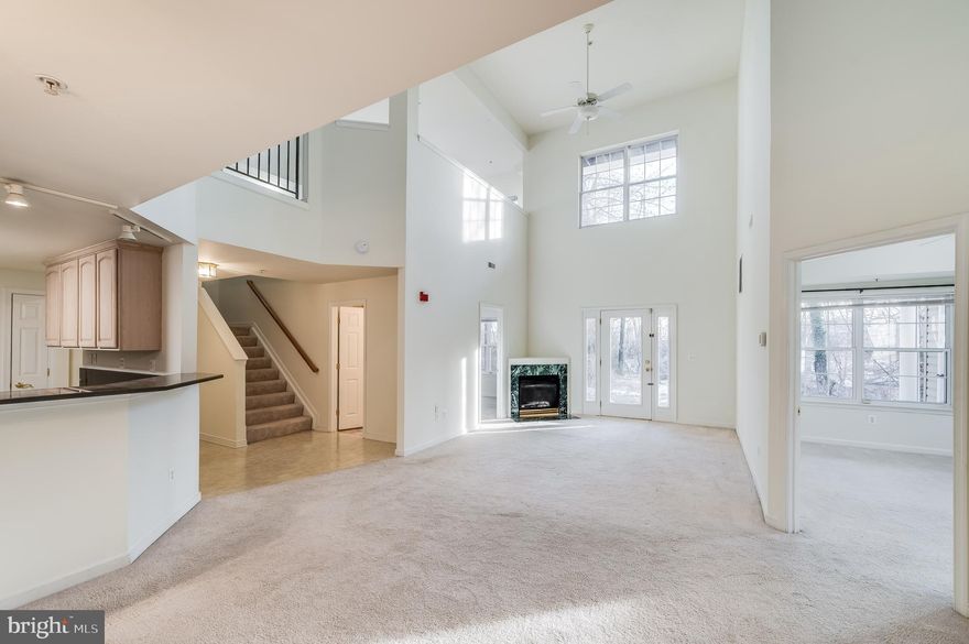 Hello, and welcome! The time has come for us to meet, and I am so excited to see you! I am not your typical condo, and I bet you are not a typical homeowner! What is it that makes me so special? I am sure you have heard the first three rules of real estate: Location, Location, and Location.  Need to get away? I am conveniently located to the major Baltimore & DC area international airports (Reagan, Dulles, and BWI).  Looking for unique gifts or dining experiences? Shopping and dining are easy around the Annapolis Mall or downtown Main Street. Explore local stores such as Lilac Bijoux, Evergreen Antiques and True Vintage, or Candles Off Main, and feed your soul with fare from CooperHawk, Boatyard Bar & Grill, Bread & Butter Kitchen, or Sunday brunch at Harry Brown's.  History or Adventure buff? I am minutes from the US Naval Academy and short drive to Arlington National Cemetery, Ft. McHenry, and more! Or reserve your spot on the water with Pirate Adventures on the Chesapeake, a ferry ride, or Yacht Charters on the Bay.  Want to play Tourist? Visiting the sites is a quick trip to the US Capitol, zoos and museums in DC and Baltimore, and more. Increase the fun by renting from Segs in the City to help get around.   Now that you have had a chance to hear about some of my surroundings, it's time to get more personal. Why would you want to fall in love with me?  Although I have a ground-level entry, my loft-style design is taking the condo experience to new heights with a 16'+ ceiling grand view from the second floor to the living area below. Light, light, light abounds, and I am not shy about sharing it with lush greenery or pets lounging in the windows. Speaking of greenery, the property backs to a wooded area, where you may observe nature in its glory. This kind of comfortable living also has three bedrooms and three full bathrooms and includes ample storage for your seasonal decor or attire.  Did I mention how much space I have to offer??? I may look like your regular garden-style condo from the outside, but, really, I'm like the TARDIS -- "bigger on the inside." In fact, my just over 2500 square feet land me at the top of the list for condos in Annapolis. How's that for bragging rights? Once you are done providing the tour to friends and family, finish off with a meal in your kitchen, where they can then admire the gorgeous granite countertops... then cozy up near the gas fireplace on those chilly evenings while watching a movie or playing games.  Today is the day, and this is our time. Let's meet right away so we can finally begin our new life together!