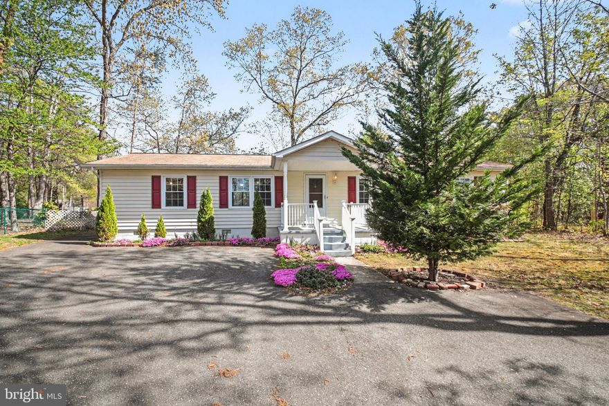 Value Priced, Move-In Ready 3BR, 2BA Rambler with Covered Front Porch, Rear Deck & Extra Parking Just Seconds to the Front Gate in Amenity-Filled Aquia Harbour! Highlights and Features Include: Paved driveway with front parking pad plus additional side parking; ideal for boat, RV, or trailer; NEW Water Heater; Covered concrete front porch with vinyl railings and columns; Foyer with half-moon solid wood entry door, ceramic tile flooring, and coat closet; Living room with ceiling fan and corner hearth feature; Dining room with hardwood floors and ceiling fan; Breakfast area with sliding glass door to rear deck. Kitchen with solid surface countertops, 36" raised panel maple cabinetry with crown molding, breakfast bar, pantry, and full appliance package; Laundry room off kitchen with Washer, Dryer, cabinetry and direct access to the backyard. Primary bedroom with ceiling fan, walk-in closet with organizer, and attached bath featuring ceramic tile flooring, deep soaking tub, and separate step-in shower with floor-to-ceiling ceramic tile surround; Two additional bedrooms with double door closets and ceiling fans; Hall bath with ceramic tile flooring, back-saver height vanity with storage and tub/shower with ceramic tile surround. Additional highlights include vinyl double-pane double-hung windows, rear deck with covered section, Level Driveway and Yard w/fully fenced backyard, gate, raised garden beds, and large shed. Located in Section One, adjacent to Business Office, Preschool, Cunningham Park, 5 blocks to the marina and fishing pier, and just a few blocks to Lyons Park, Government Island, Horse Stables and the dog park, this home offers unmatched convenience along with full access to Aquia Harbour amenities. Water Heater-2026; Roof-2016; HVAC-2013.  The abundant Aquia Harbour amenities include a 24-hour manned front gate and residents-only rear gate, two pools, state-certified police force, fire department, marina with boat ramp and fishing pier, kayak and canoe launches, golf course with pro shop, putting green, driving range, and the clubhouse restaurant, dog park, horse stables with riding areas and trails, secure storage lot, community garden, preschool, fishing park, and multiple additional parks with tot lots, tennis, and basketball courts. The community is surrounded by natural beauty with wildlife including deer, fox, bald eagles, and blue heron, and hosts events throughout the year such as Independence Day celebrations with parade and fireworks, Oktoberfest, outdoor movies, and more.***OFFERS PRESENTED ASAP AFTER RECEIPT***