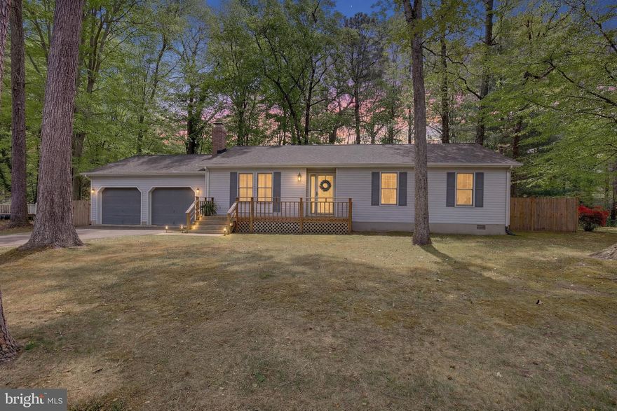 Charming one-level home in a water-privileged neighborhood! Nestled on a beautiful, tree-lined lot, this inviting property features a welcoming front porch perfect for relaxing. Plus, enjoy a short walk to the community beach and boat ramp with access to Mill Creek.

Inside, you’ll find a spacious living room complete with a white washed brick wood-burning fireplace and plantation shutters. The kitchen has been recently updated with white shaker cabinets and opens to a large breakfast area with space for a dining table. New LVP flooring flows throughout the kitchen, dining area, living room, and hallway.

The hall bathroom has been tastefully renovated with new octagon tile flooring, a modern shower insert, and updated vanity. The spacious primary bedroom overlooks the fully fenced backyard and includes a private en suite bathroom. Two additional bedrooms complete the home.

Step outside through sliding glass doors onto a wood deck, perfect for entertaining or enjoying the peaceful backyard with mature trees and a designated fire pit area.

Additional features include ample parking and a two-car garage.

Don’t miss this rare opportunity—your chance to call Drum Point home!