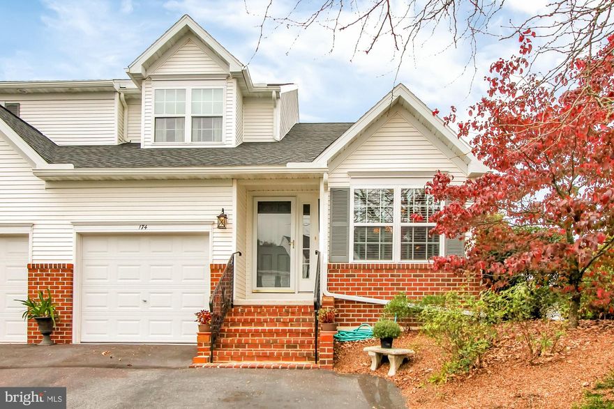 Exceptional end-unit town home in Exeter Township's Wingspread community! The brick steps welcomes you into the foyer featuring hardwood floors and an ample coat closet. The kitchen has been updated with top of the line Granite countertops providing loads of prep space. A lovely informal dining area is a great spot to view the front garden through the bay window. The dining room is spacious enough to host a crowd and is open to both the kitchen and living rooms. The living room has vaulted ceilings, a cozy gas fireplace with marble surround and sliding doors leading out to the deck. The deck, with awning,  and lower patio are perfect spots to enjoy the privacy of the open space and wildlife! This home also offers a first floor master bedroom with private en-suite bath that has been completely remodeled and walk-in closet. The powder room and laundry are also located on the main level. The second floor loft overlooking the living room is a fantastic bonus space for a home office, dedicated classroom space or 2nd family room. There are 2 additional bedrooms and a shared full hall bath on this level. The lower level is 'huge'! The owners finished the space creating a storage room and mechanical room. The main space is carpeted, has a drop ceiling and the block walls have been sealed &painted! The lower level walks out to a patio. This will not last! Schedule your tour today!